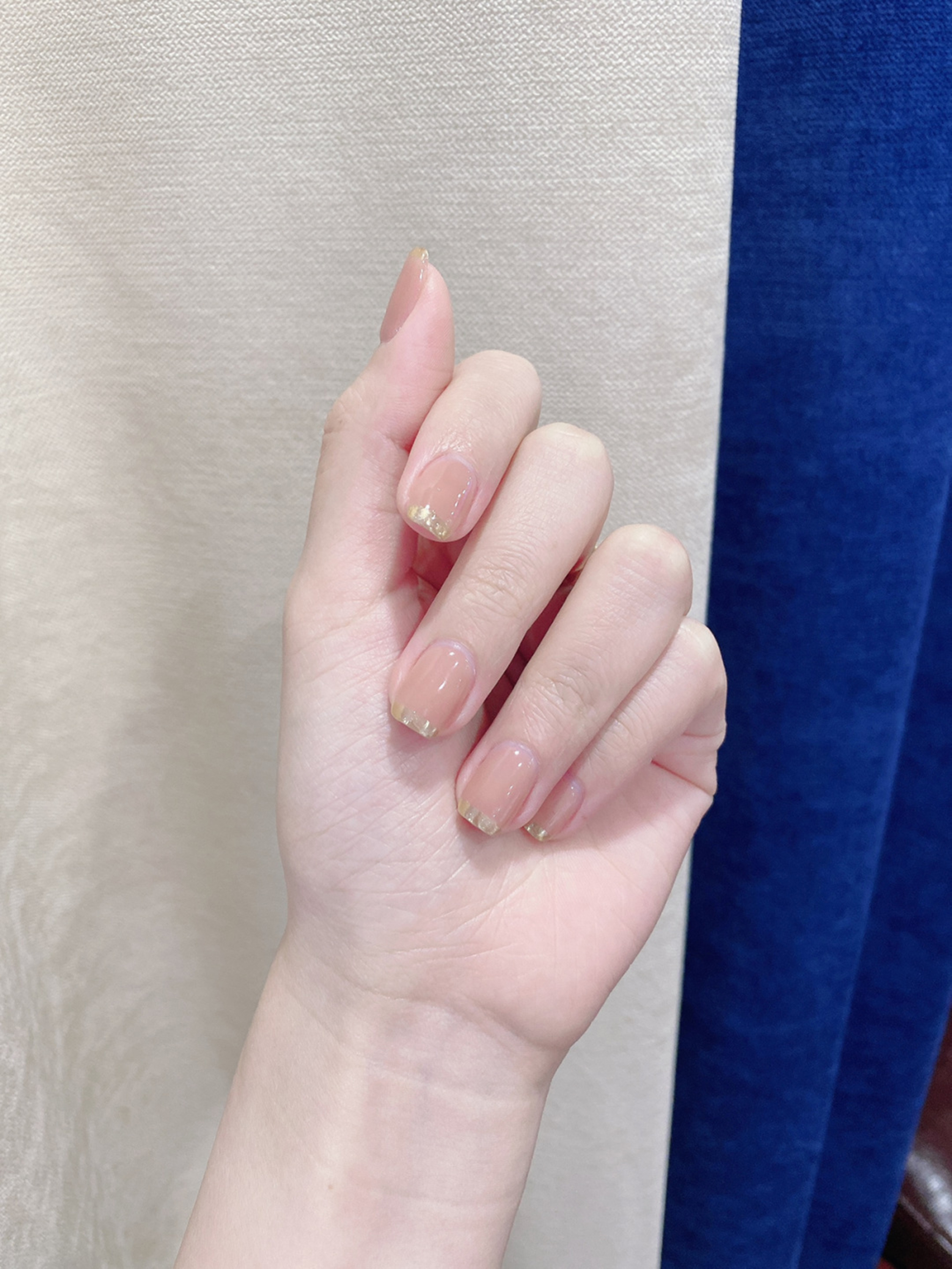 Nude and Gold Minimal Short Oval Nails shown as a nail art design with nude, gold, simple, minimal, elegant, oval and short details.