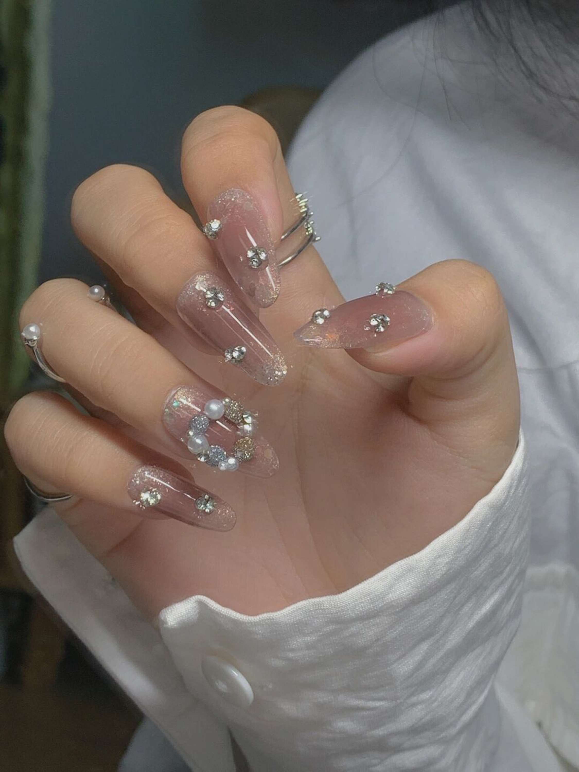 Nude and Silver 3D Long Coffin Nails shown as a nail art design with nude, silver, 3d, elegant, coffin and long details.