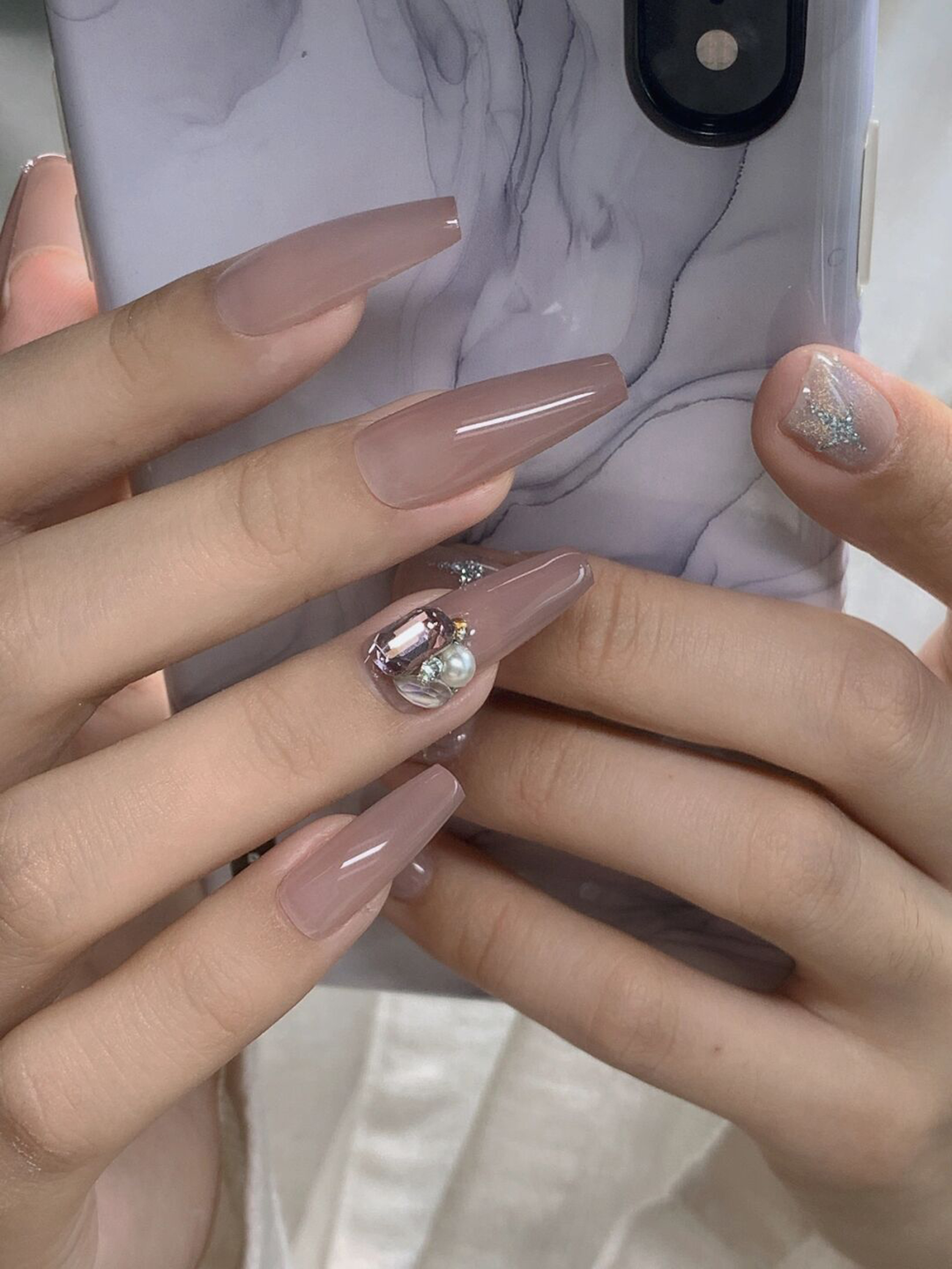 Nude and Silver Glitter Long Coffin Nails shown as a nail art design with nude, silver, 3d, elegant, glitter, coffin and long details.