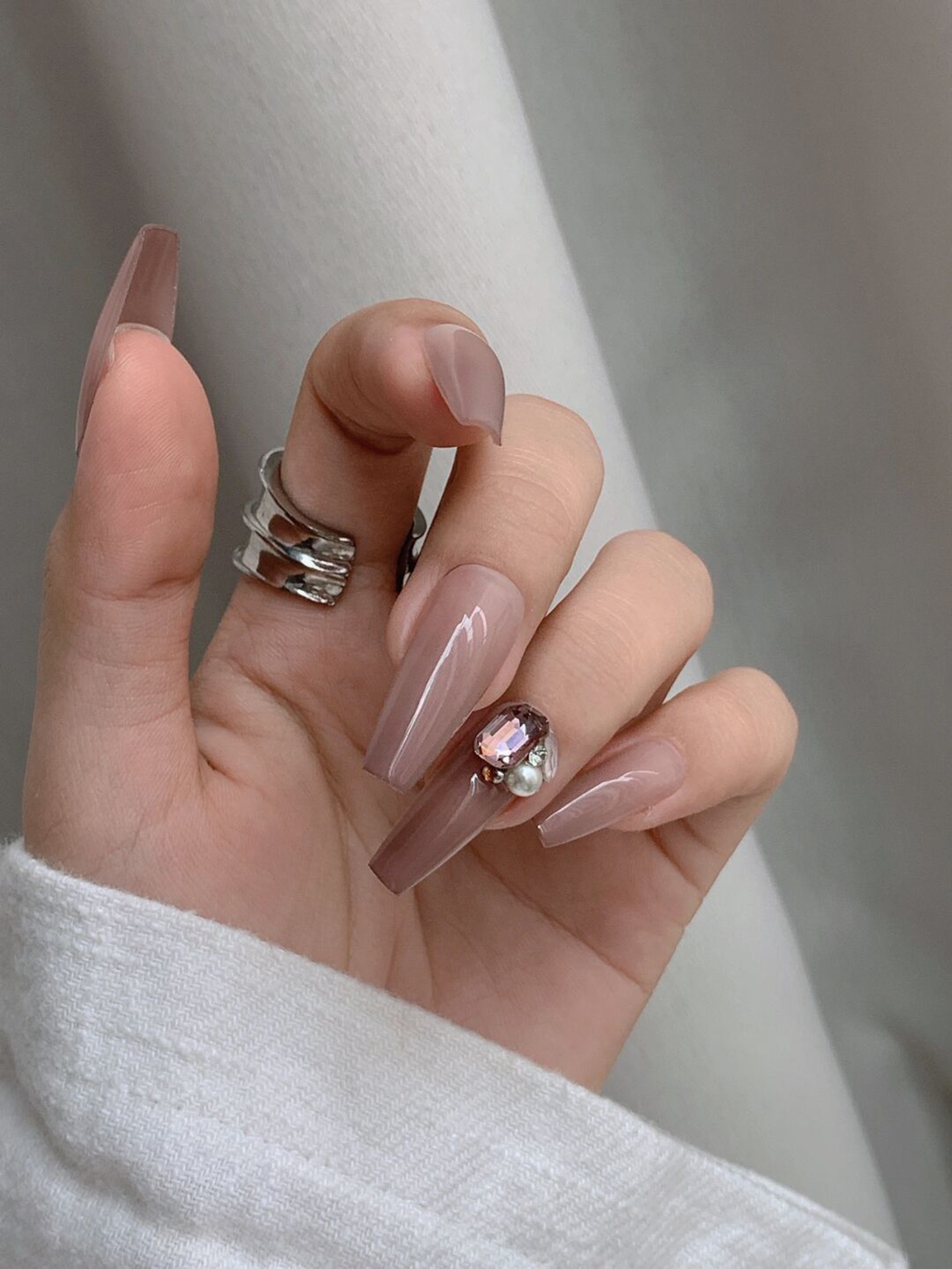 Nude 3D Long Coffin Nails shown as a nail art design with nude, elegant, 3d, coffin and long details.