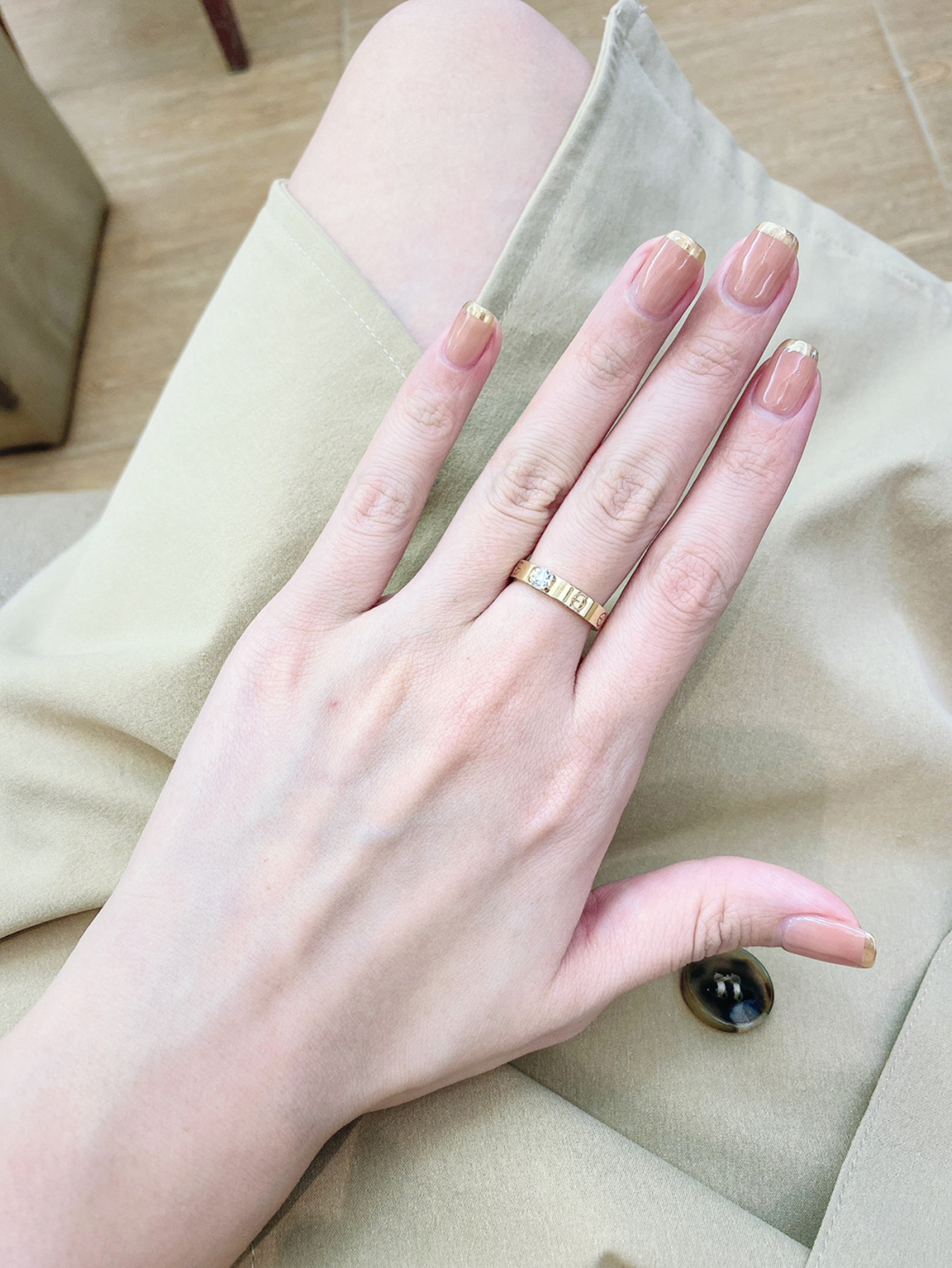 Nude and Gold French Tip Square Nails shown as a nail art design with nude, gold, french, elegant, square and medium details.