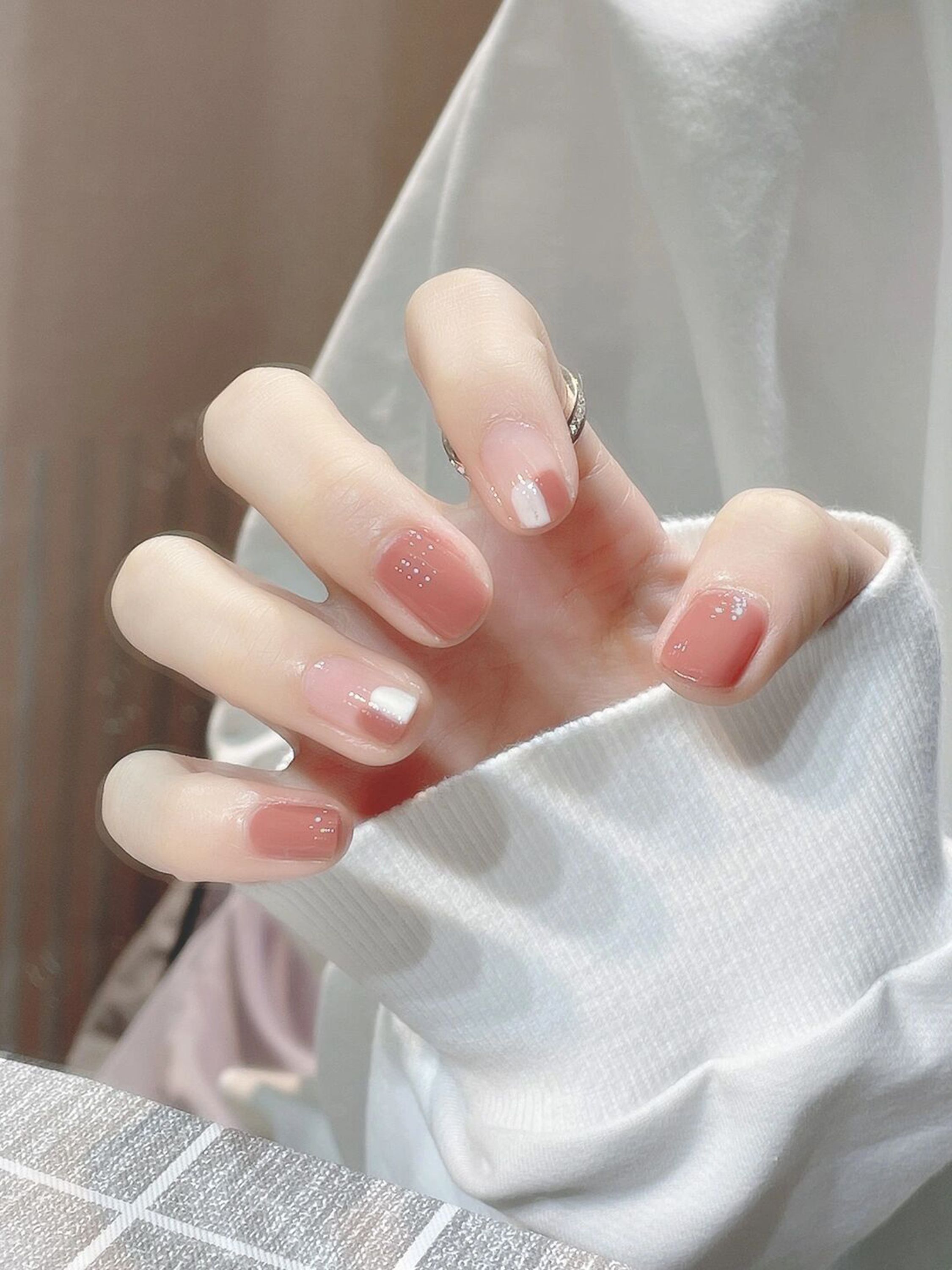 Nude and White Minimal Short Nails shown as a nail art design with nude, white, simple, minimal and short details.