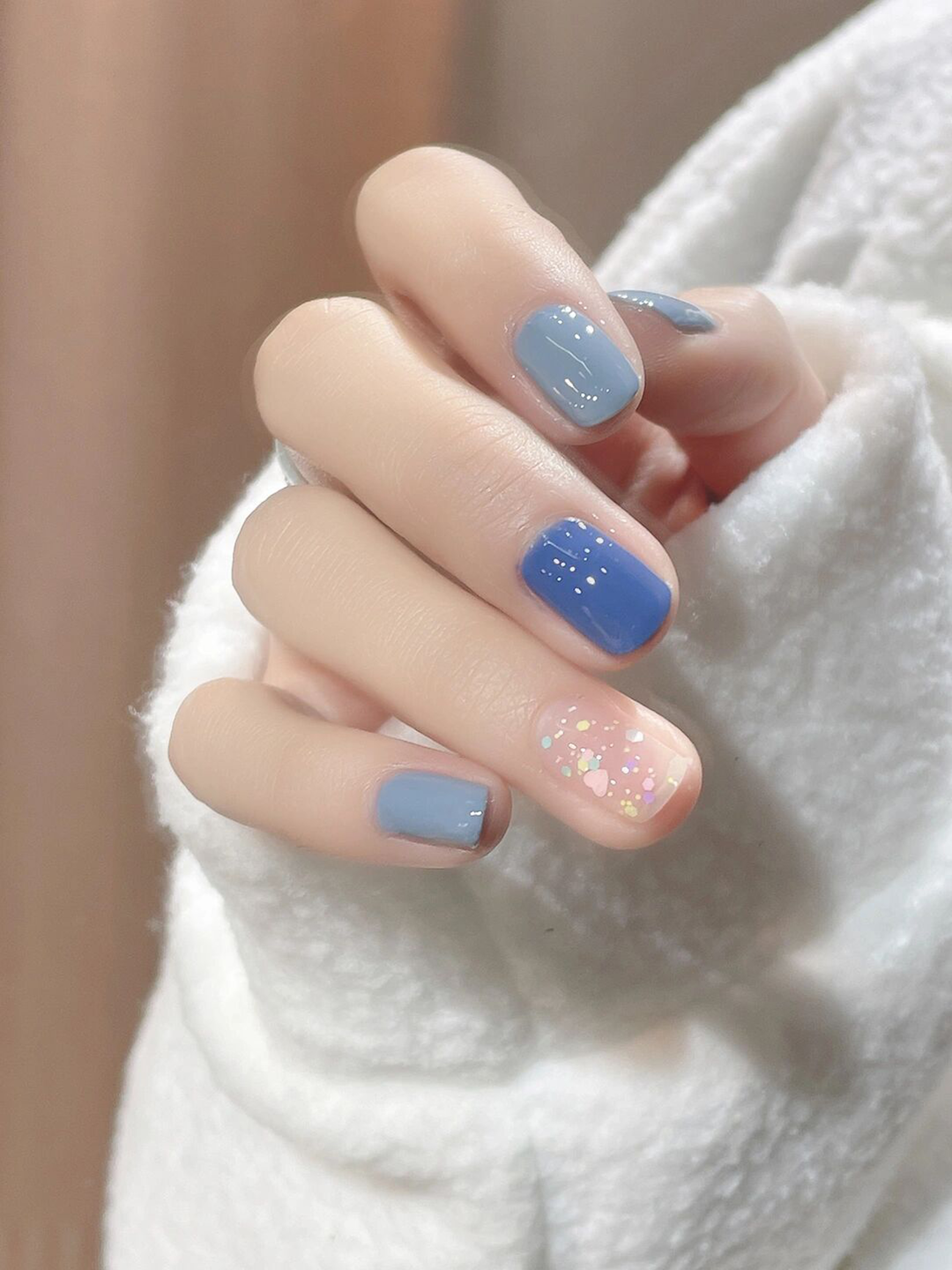 Pastel, Blue and Nude Glitter Short Nails shown as a nail art design with pastel, blue, nude, glitter, cute and short details.