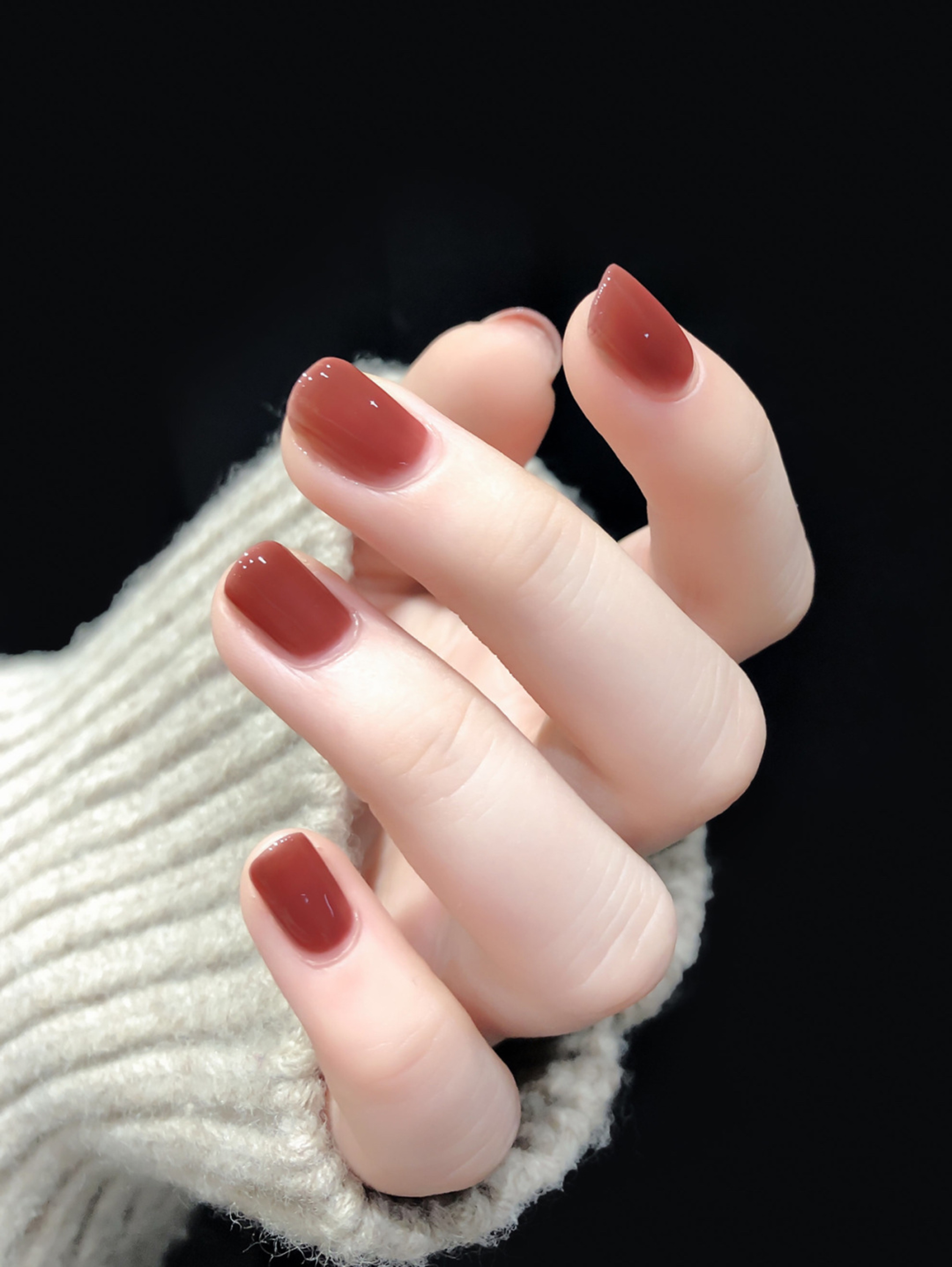 Burgundy short square nails with a simple glossy finish.