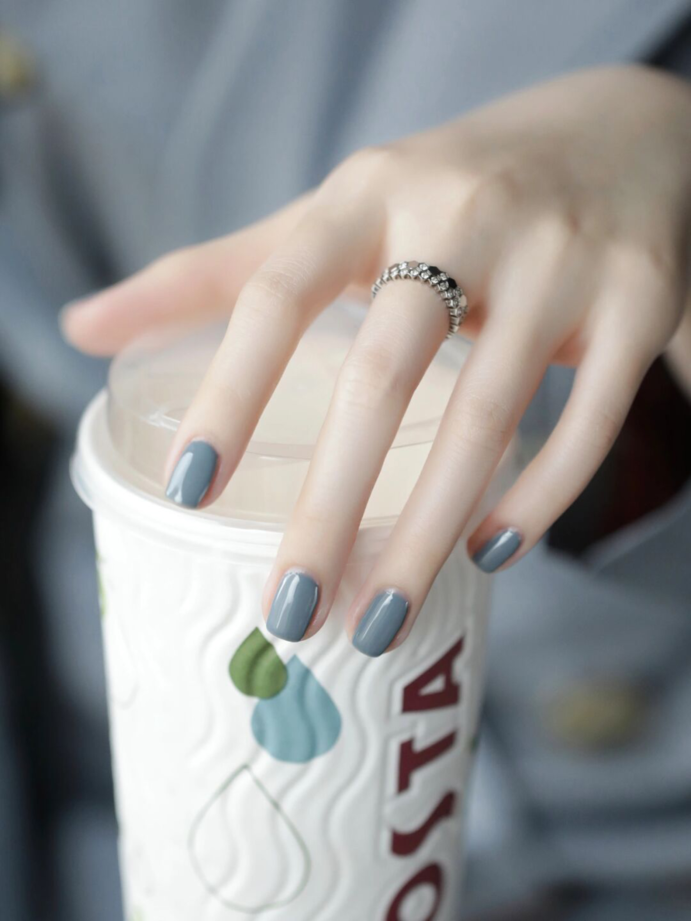 Gray blue oval nails with a simple glossy finish.