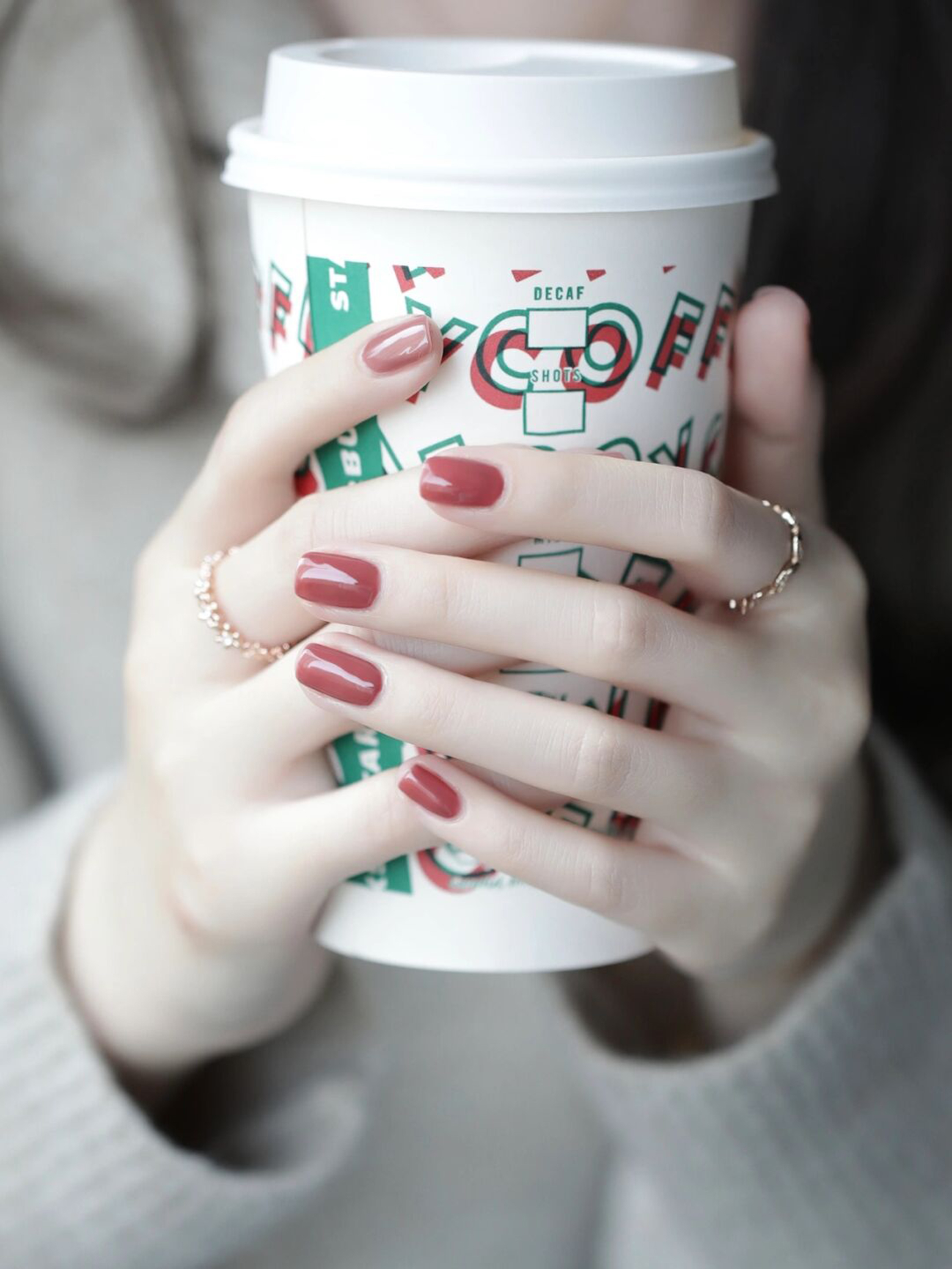 Red oval nails with a simple glossy finish.