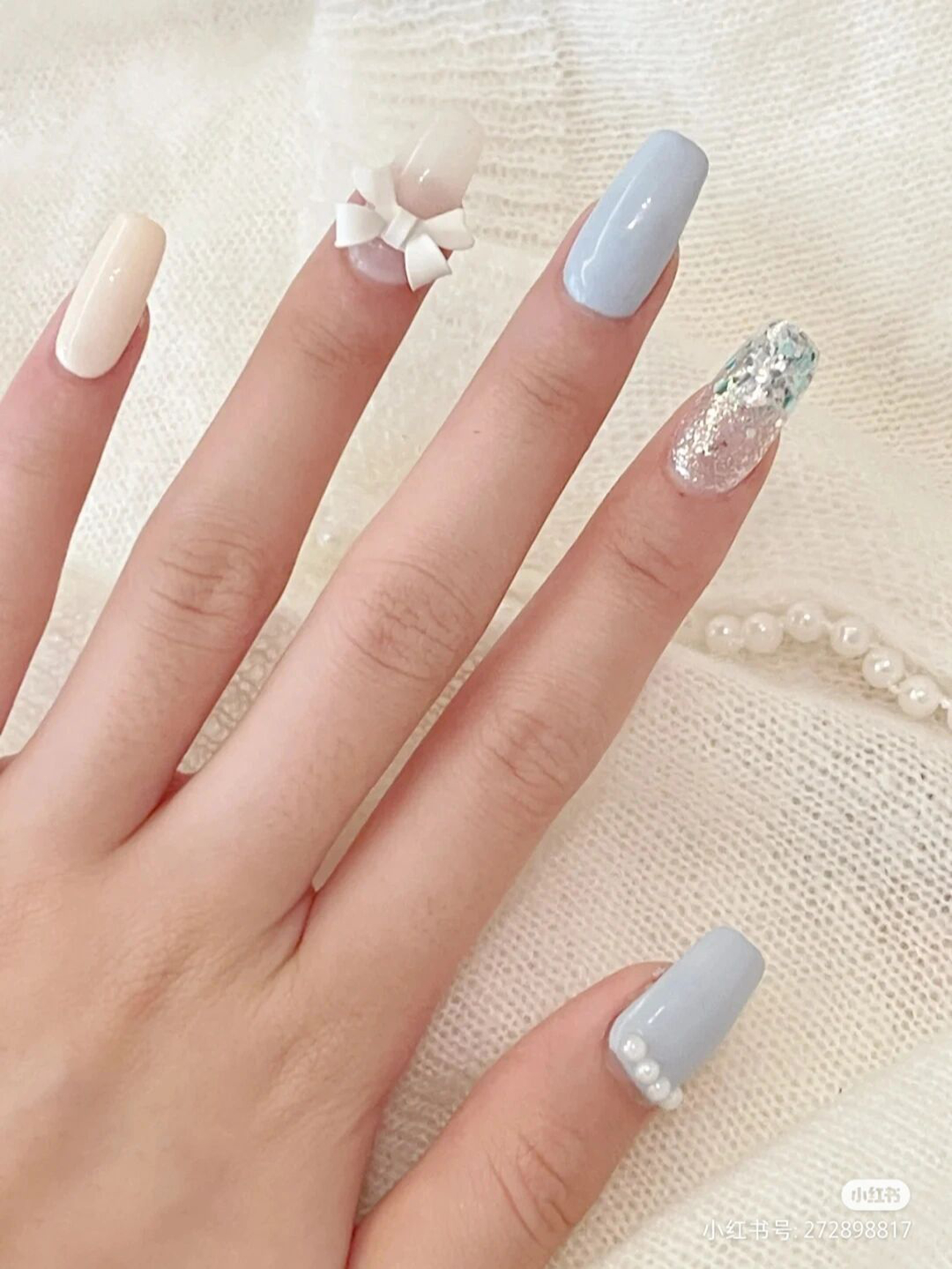 Baby Blue, Beige and White 3D Long Square Nails shown as a nail art design with baby blue, beige, white, elegant, 3d, square and long details.