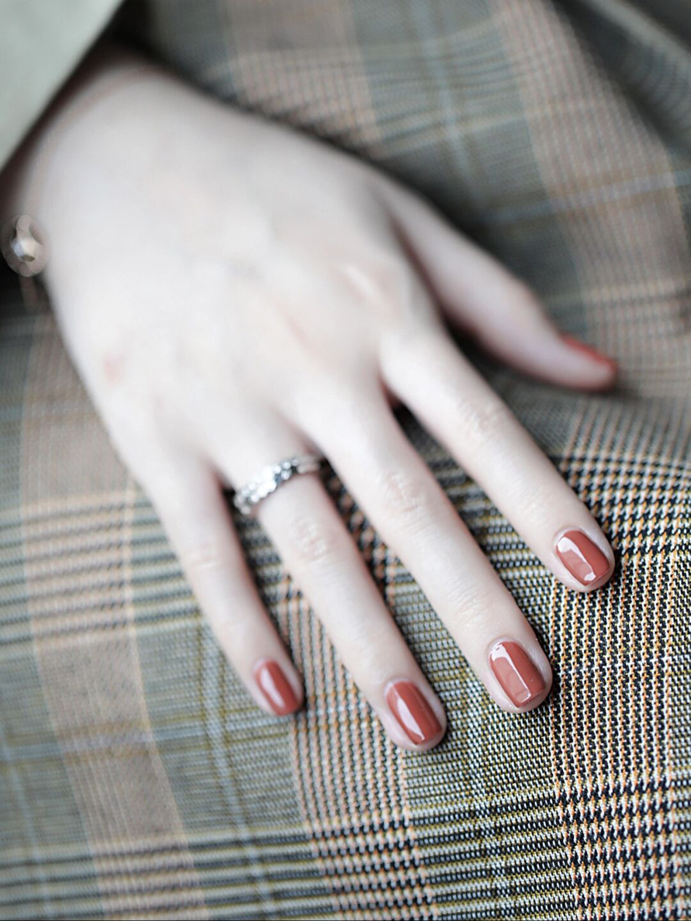Red short square nails with a simple glossy finish.