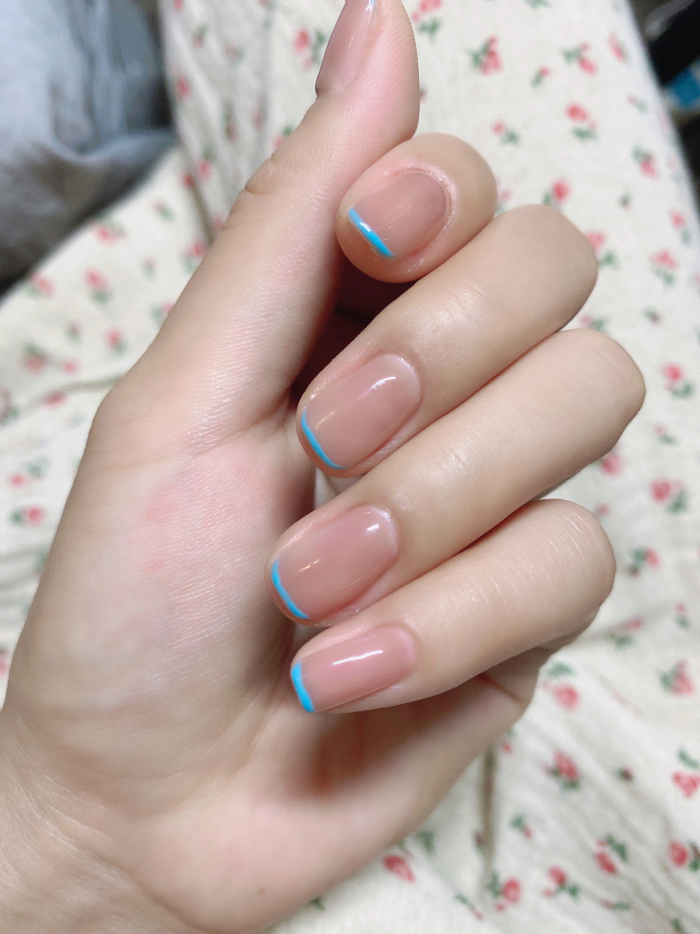 Nude and Blue French Tip Short Round Nails shown as a nail art design with nude, blue, french, minimal, round and short details.