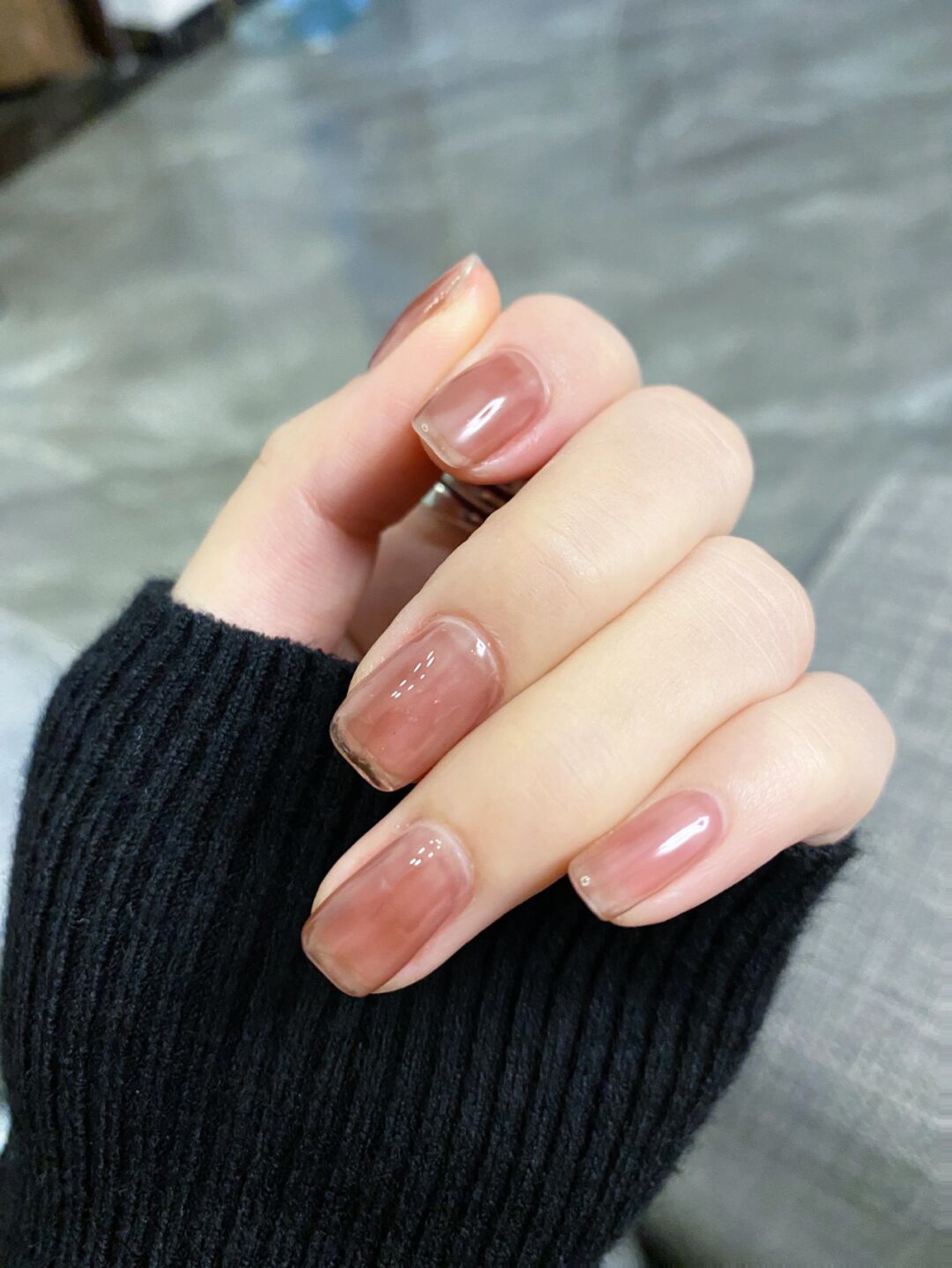 Nude brown square nails with a glossy jelly finish.
