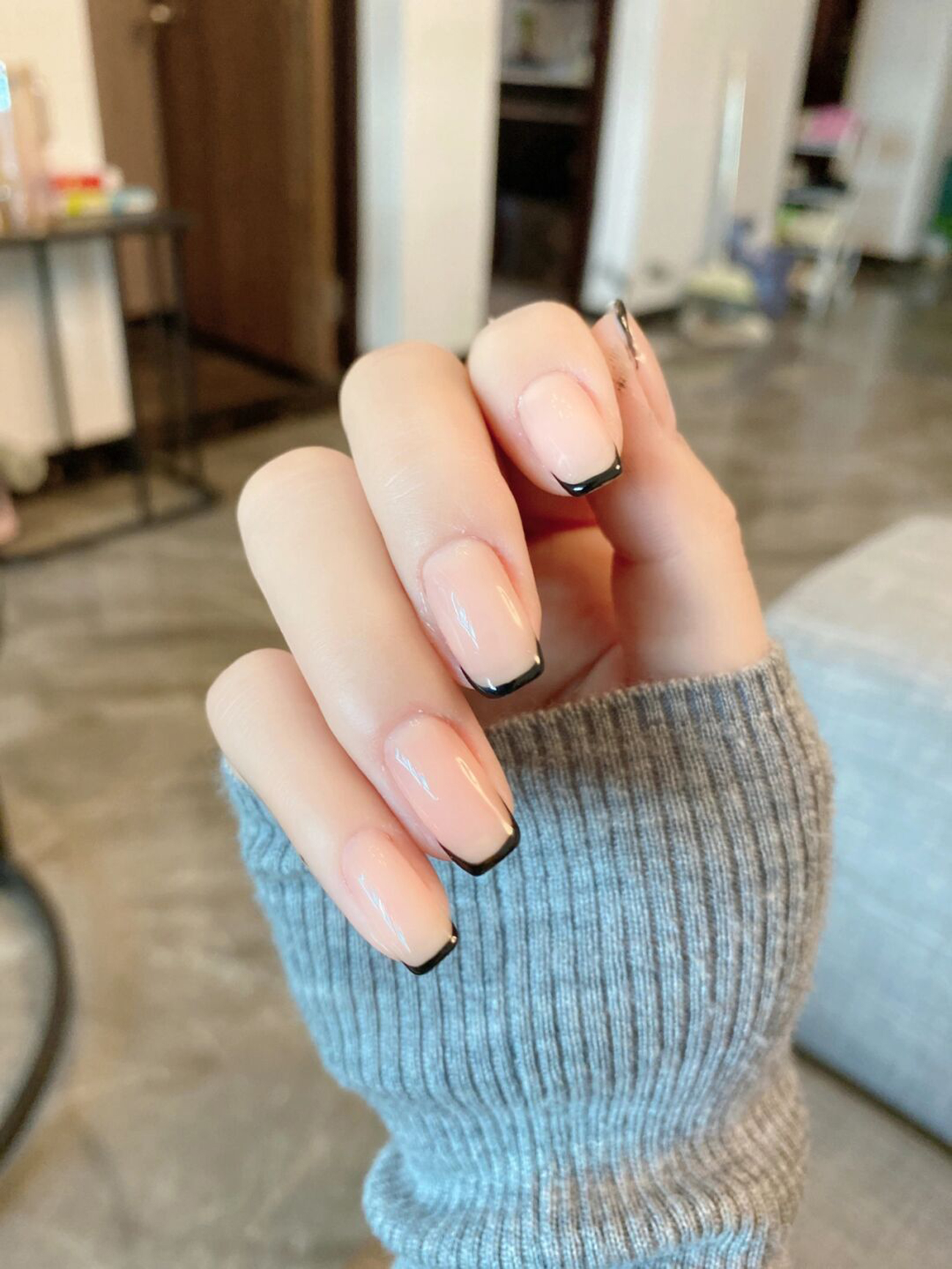 Nude and Black French Tip Square Nails shown as a nail art design with nude, black, french, simple, square and medium details.