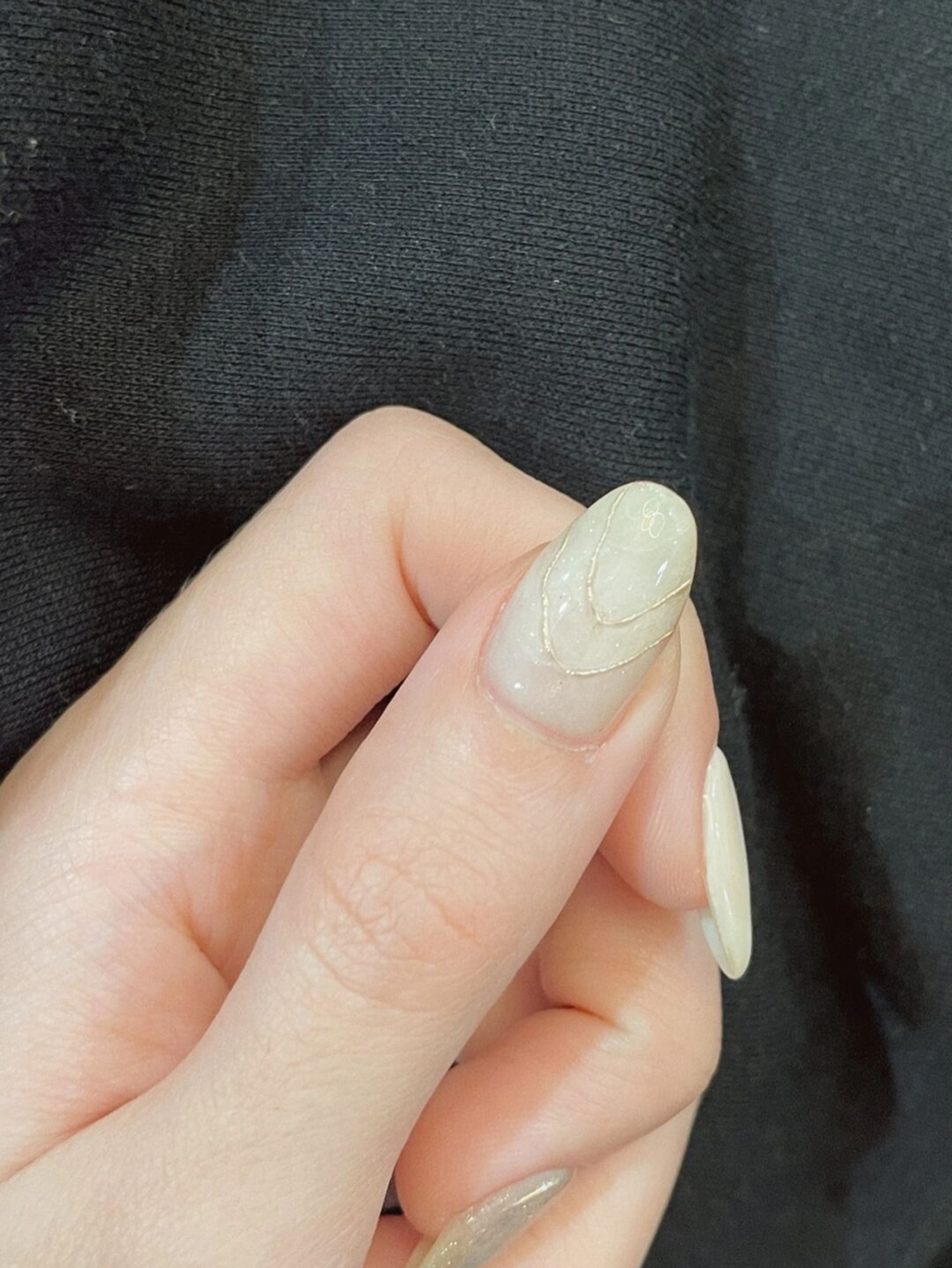 long almond white nude gold nail design with floral and elegant and gel details and flower accents