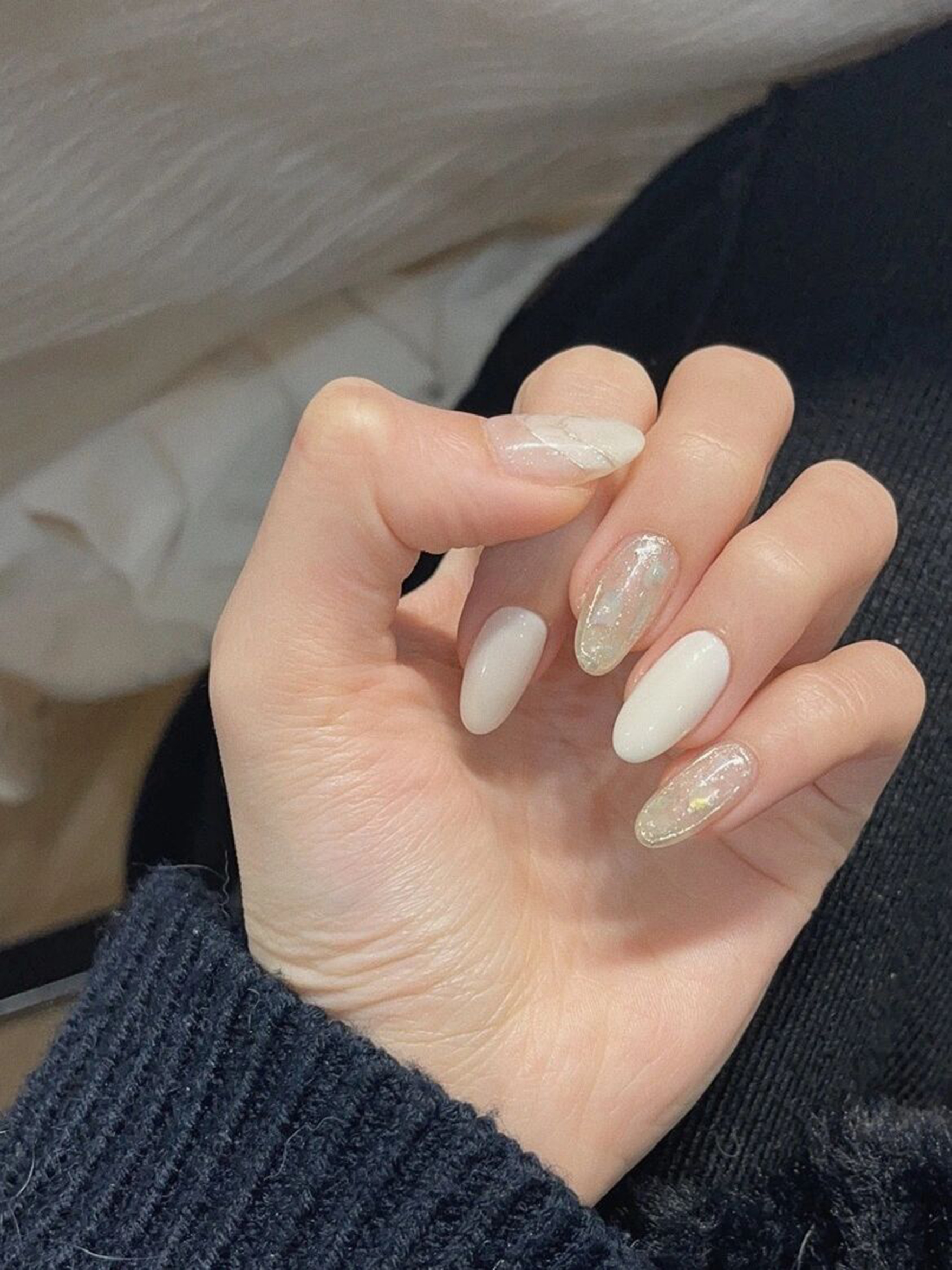 White Glitter Almond Nails shown as a nail art design with white, elegant, glitter, almond and medium details.