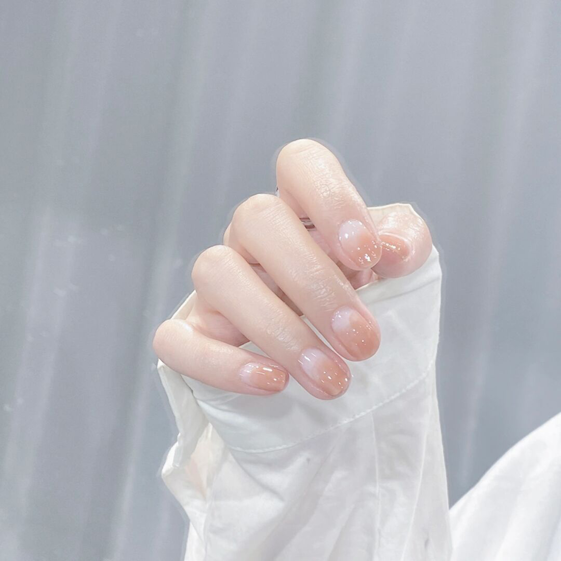 medium oval nude pink nail design with simple and elegant and gel details