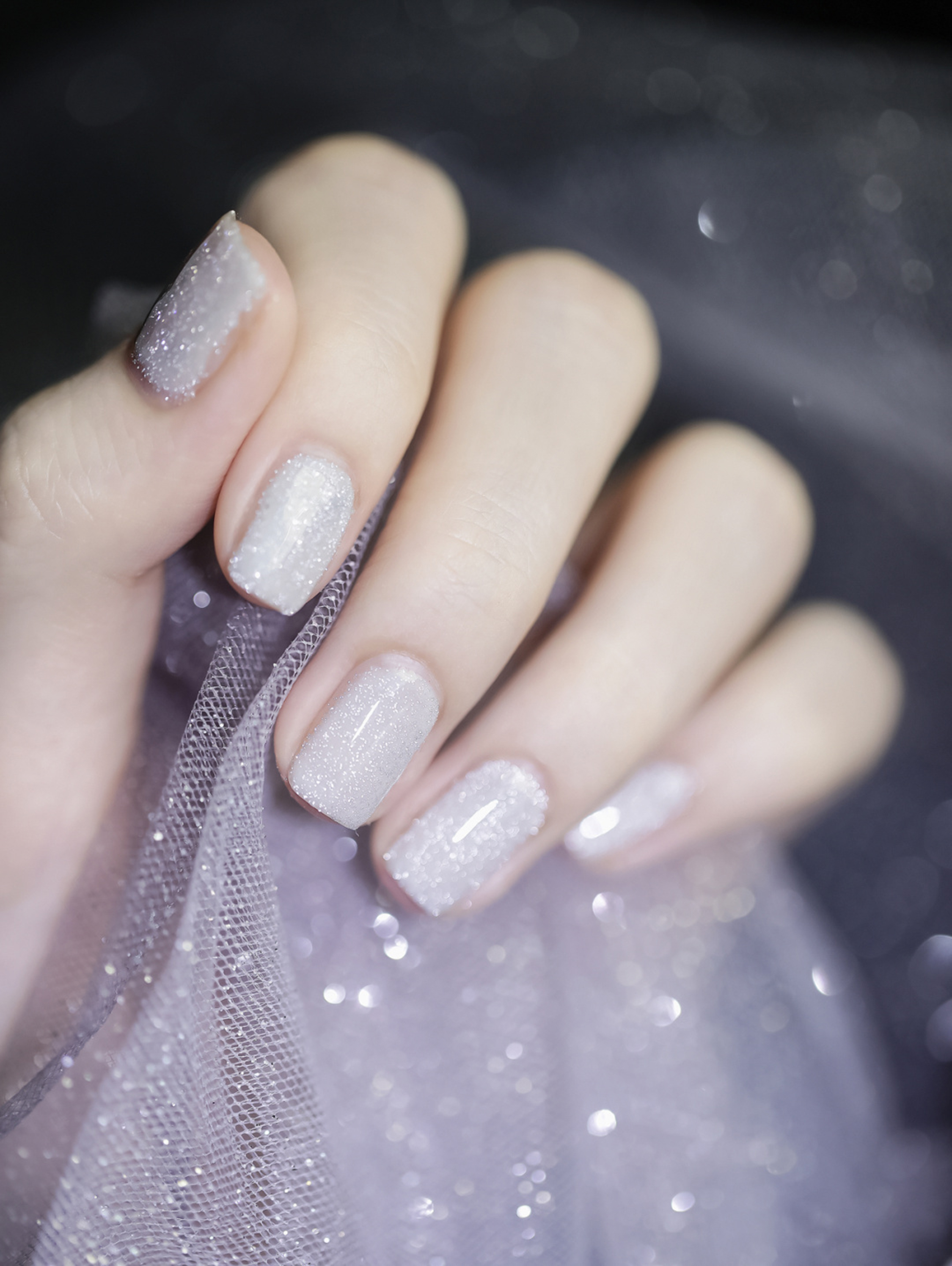 White and Silver Glitter Square Nails shown as a nail art design with white, silver, glitter, elegant, square and medium details.