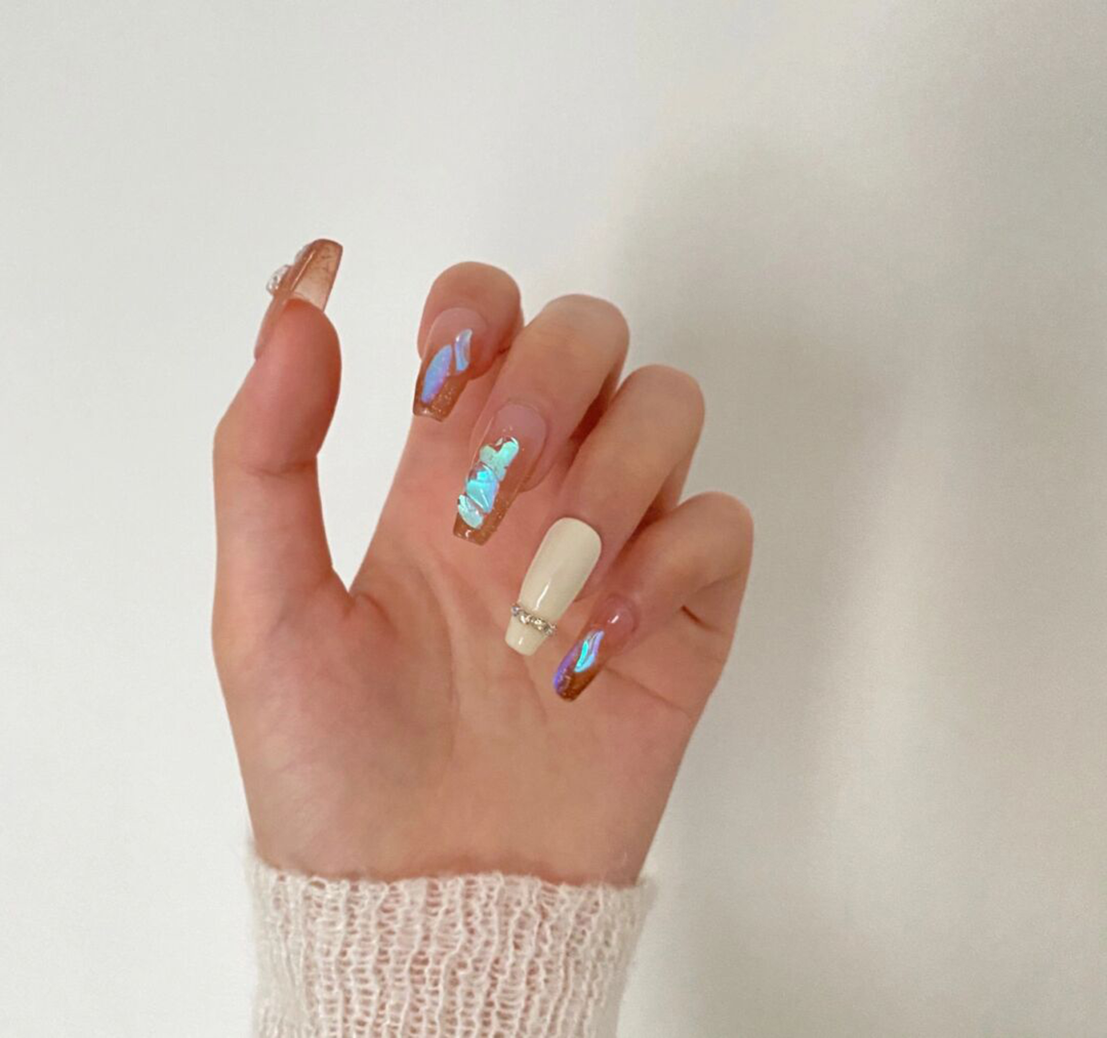 long coffin brown nude white nail design with chrome and 3d and glitter details