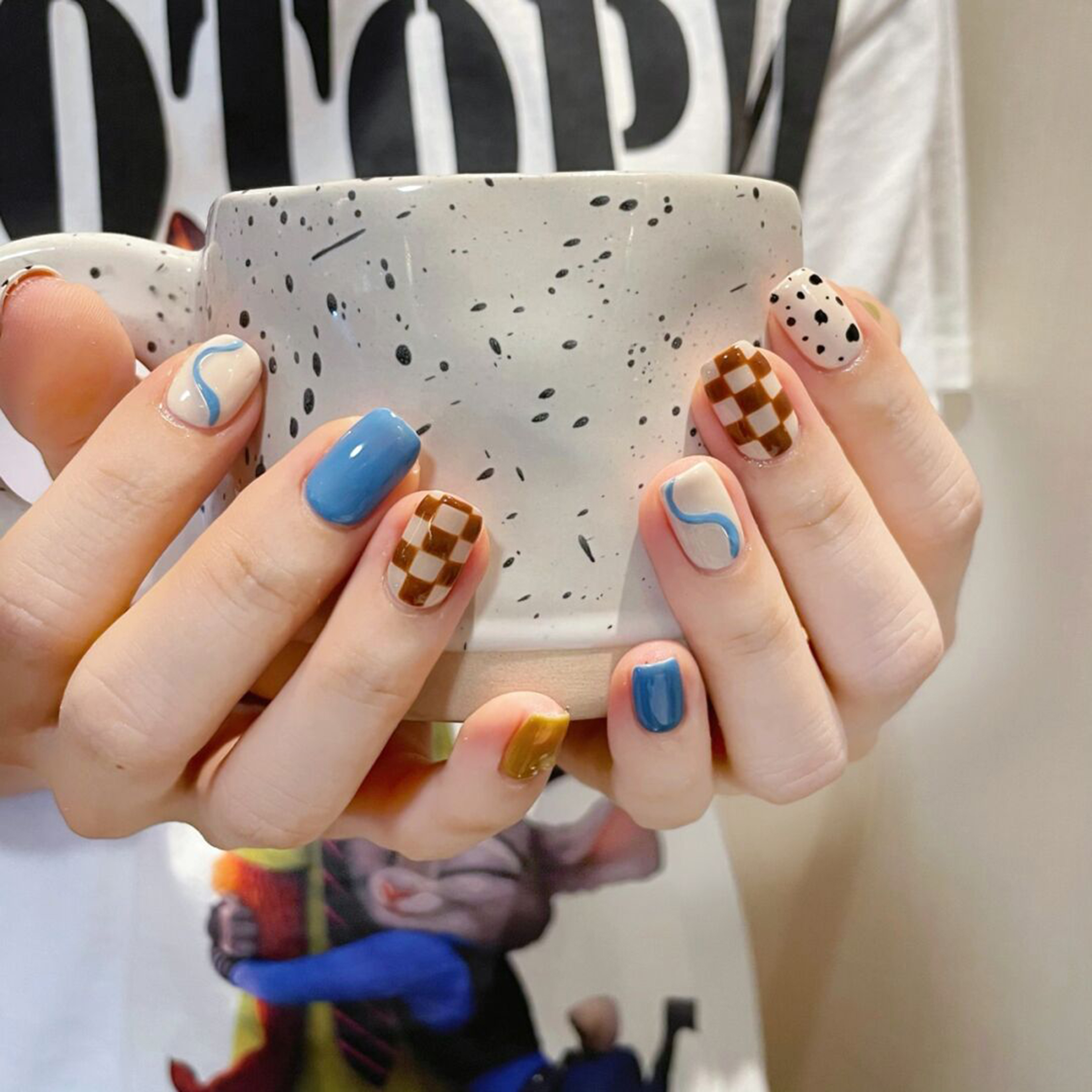Brown, Blue and White Checkerboard Short Square Nails shown as a nail art design with brown, blue, white, simple, checkerboard, square and short details.