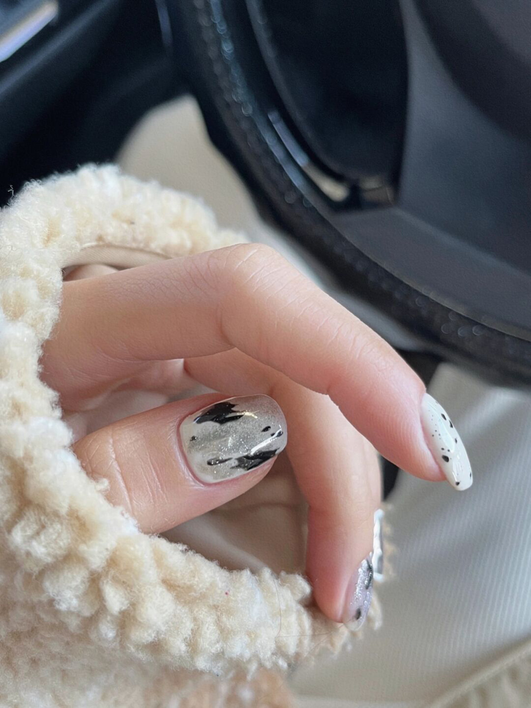 White and Black Marble Short Nails shown as a nail art design with white, black, marble and short details.