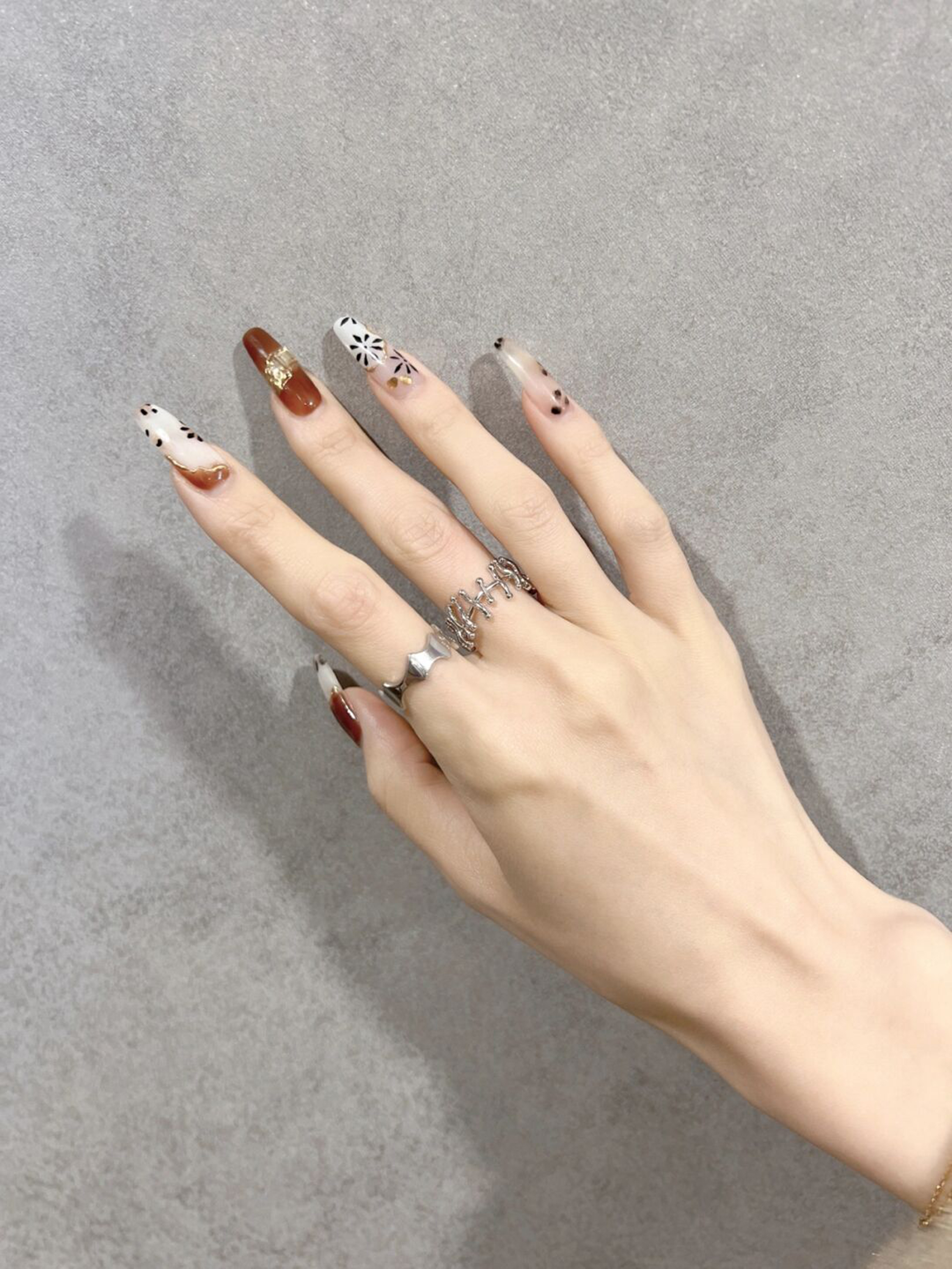 Nude Elegant Long Almond Nails shown as a nail art design with nude, elegant, almond and long details.