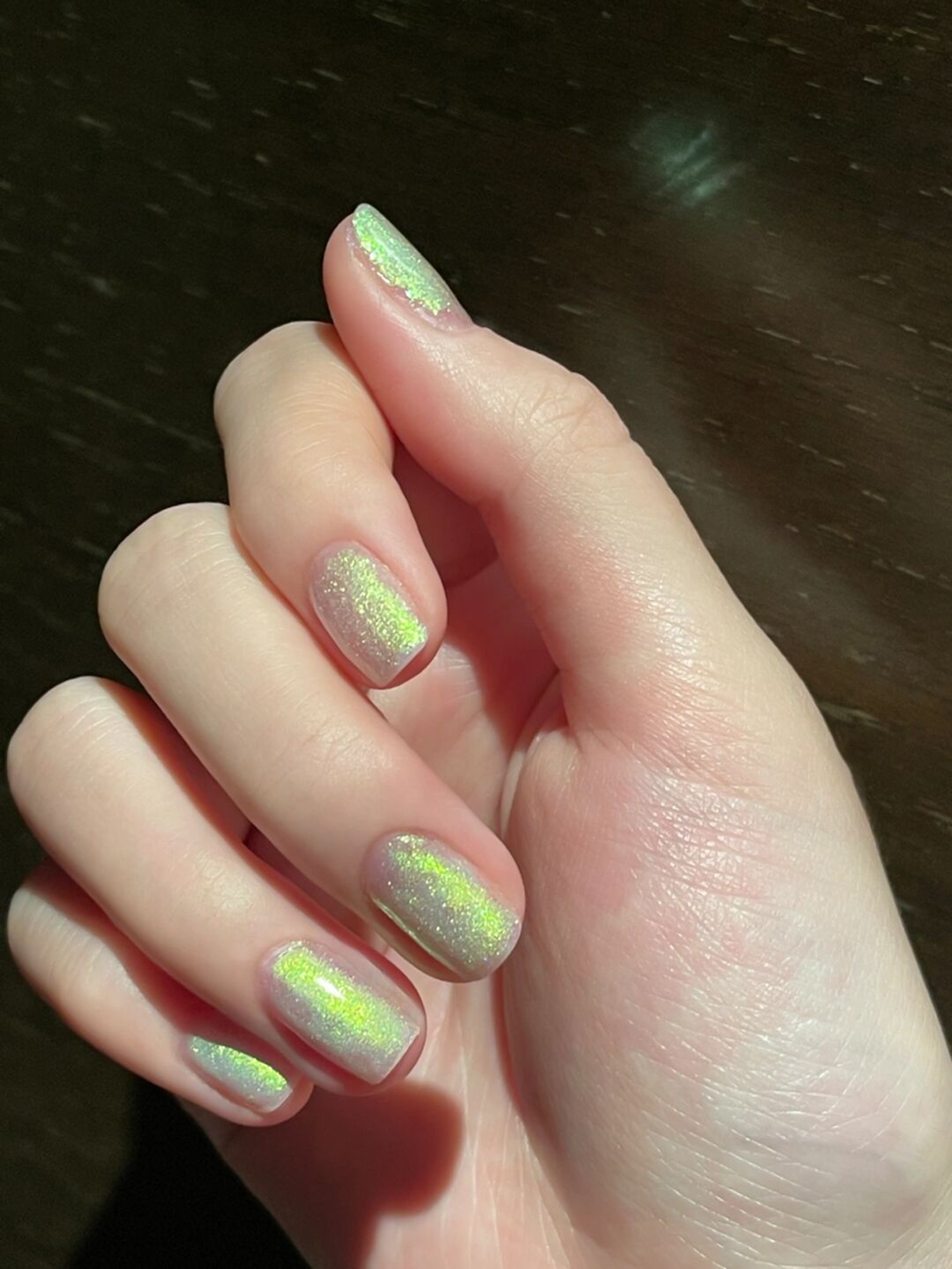 Green Chrome Short Round Nails shown as a nail art design with green, chrome, round and short details.