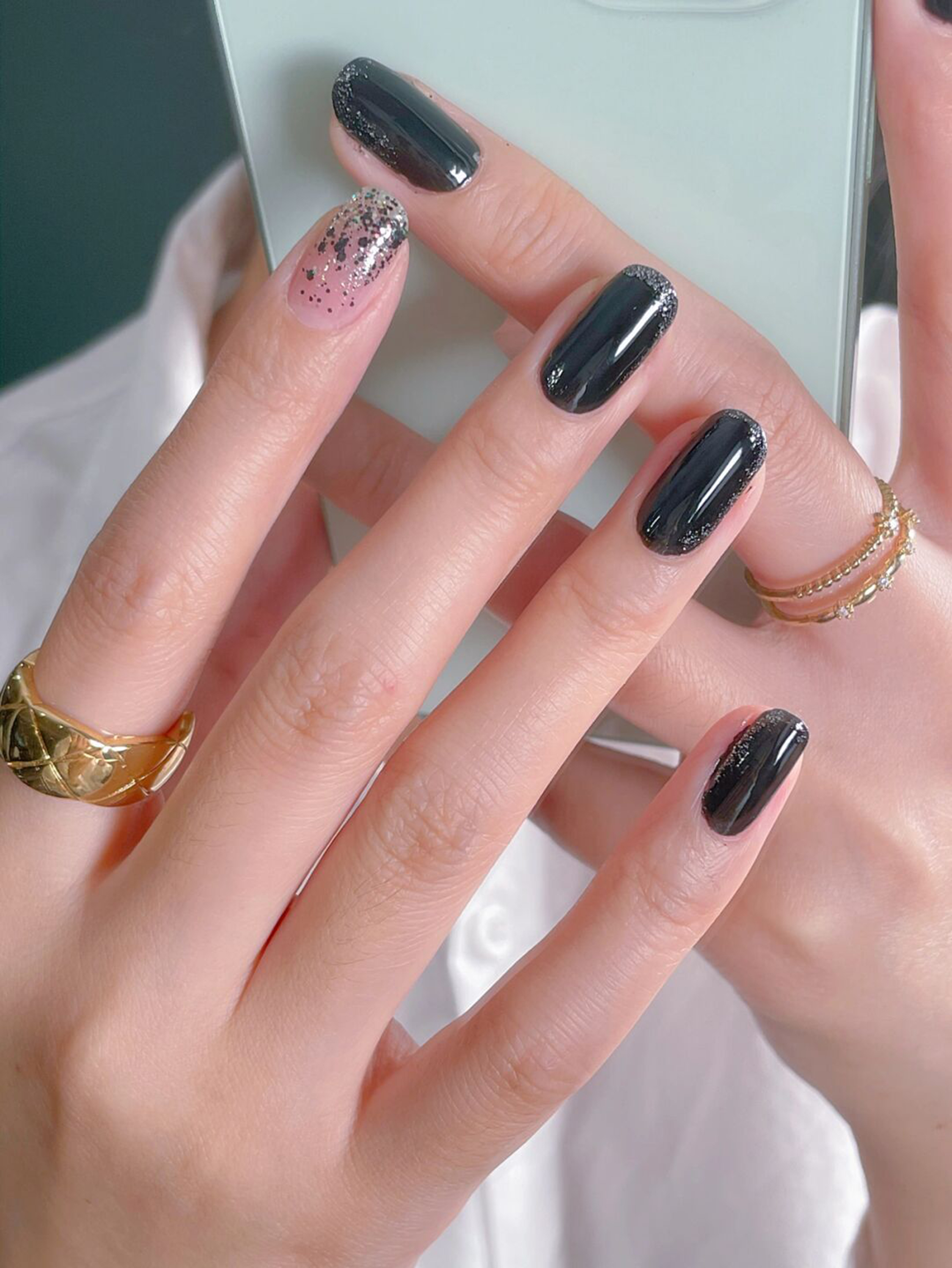 Black and Pink Ombre Short Round Nails shown as a nail art design with black, pink, glitter, ombre, round and short details.