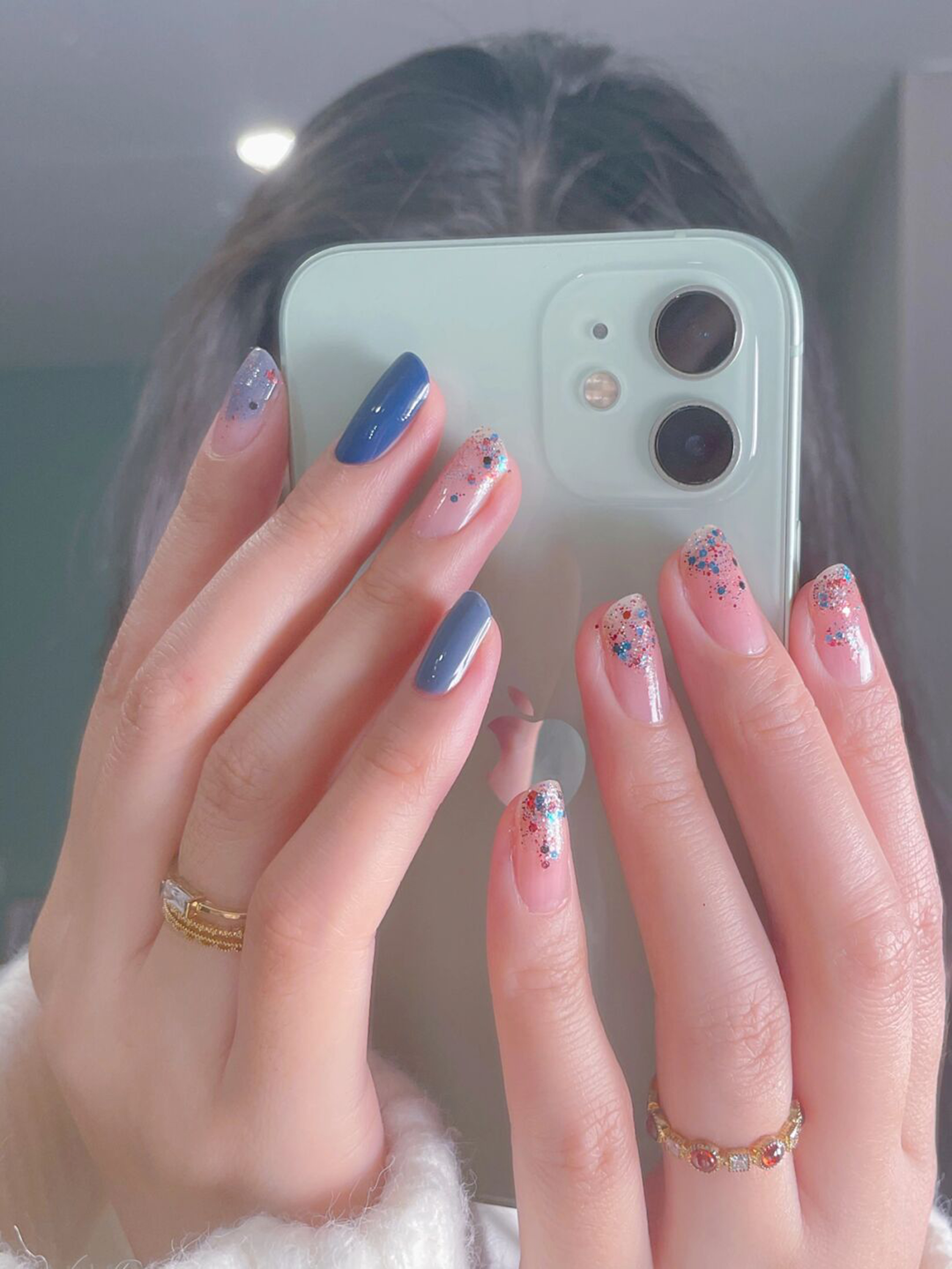 Blue Ombre Short Round Nails shown as a nail art design with blue, glitter, ombre, round and short details.
