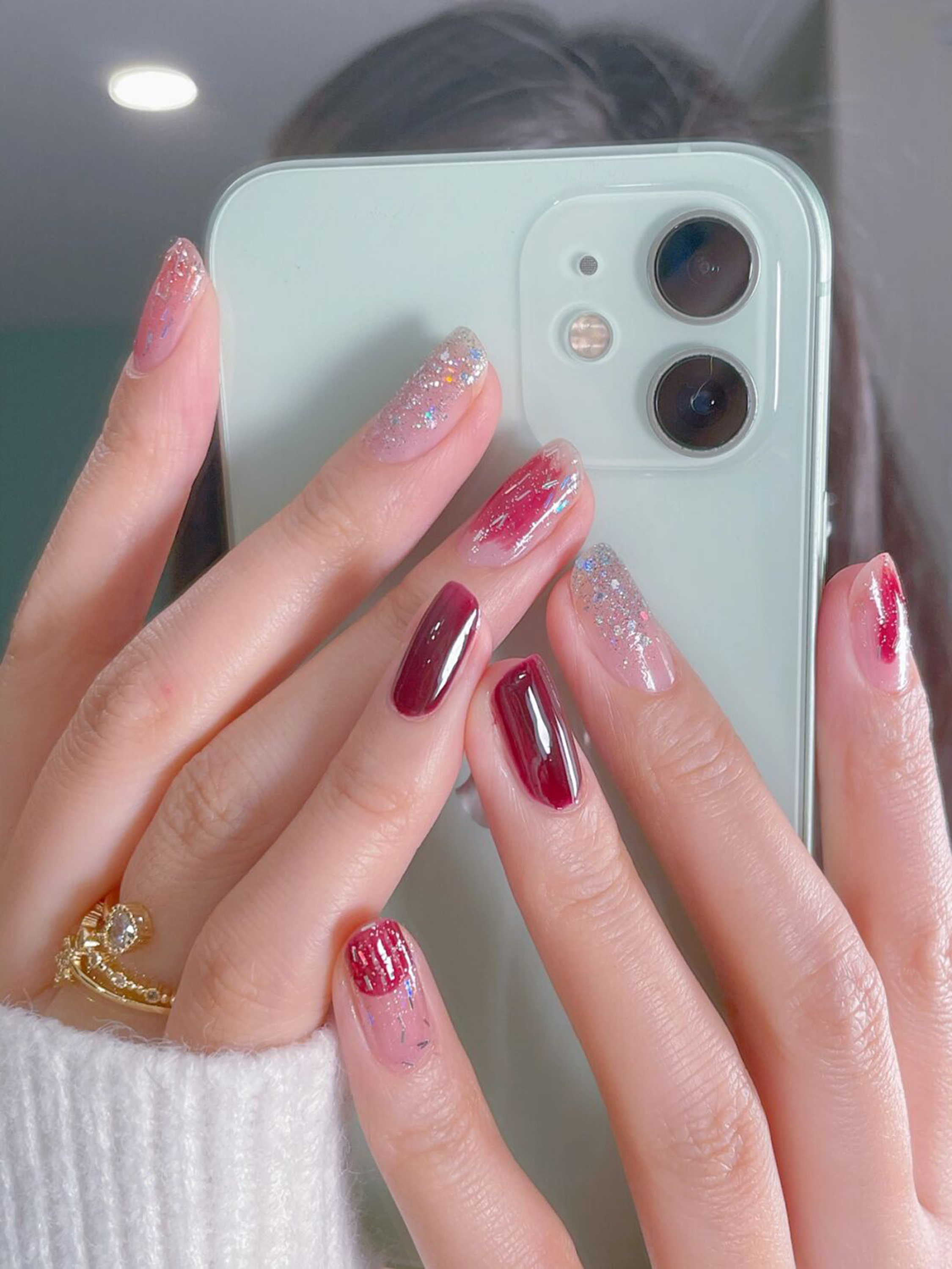 Red Ombre Short Round Nails shown as a nail art design with red, glitter, ombre, round and short details.