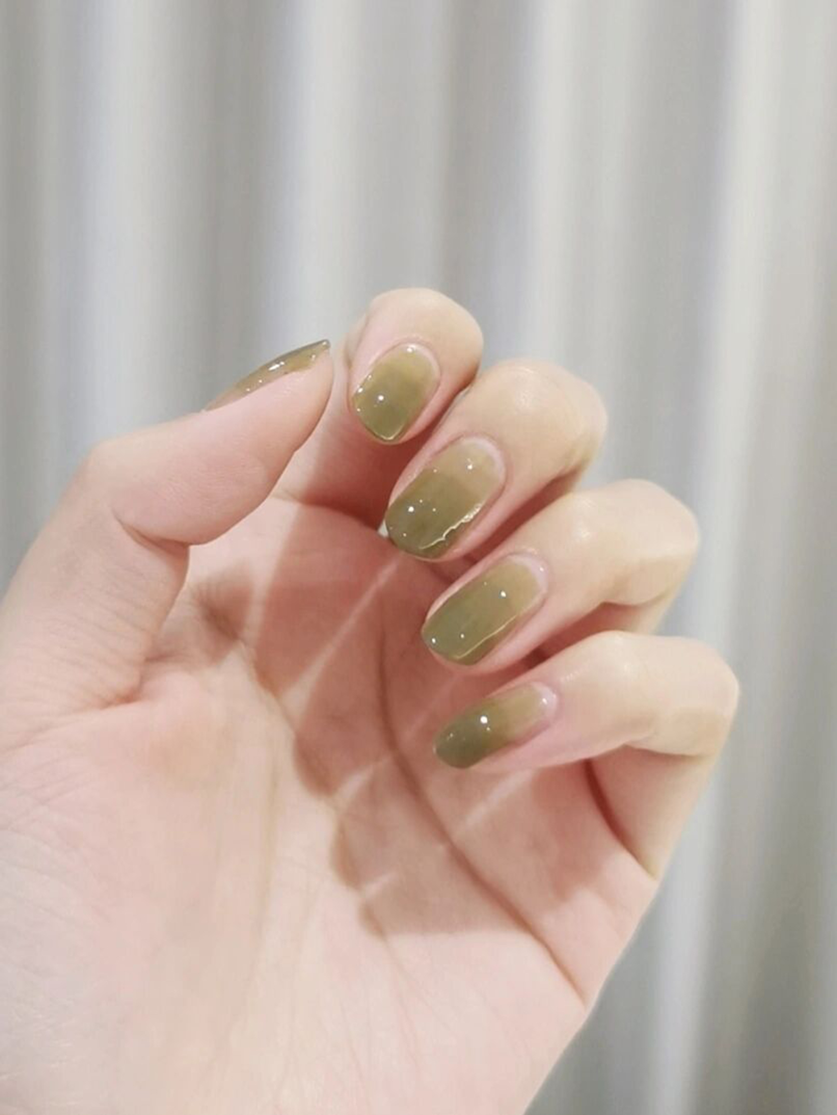 Green Ombre Short Round Nails shown as a nail art design with green, ombre, round and short details.