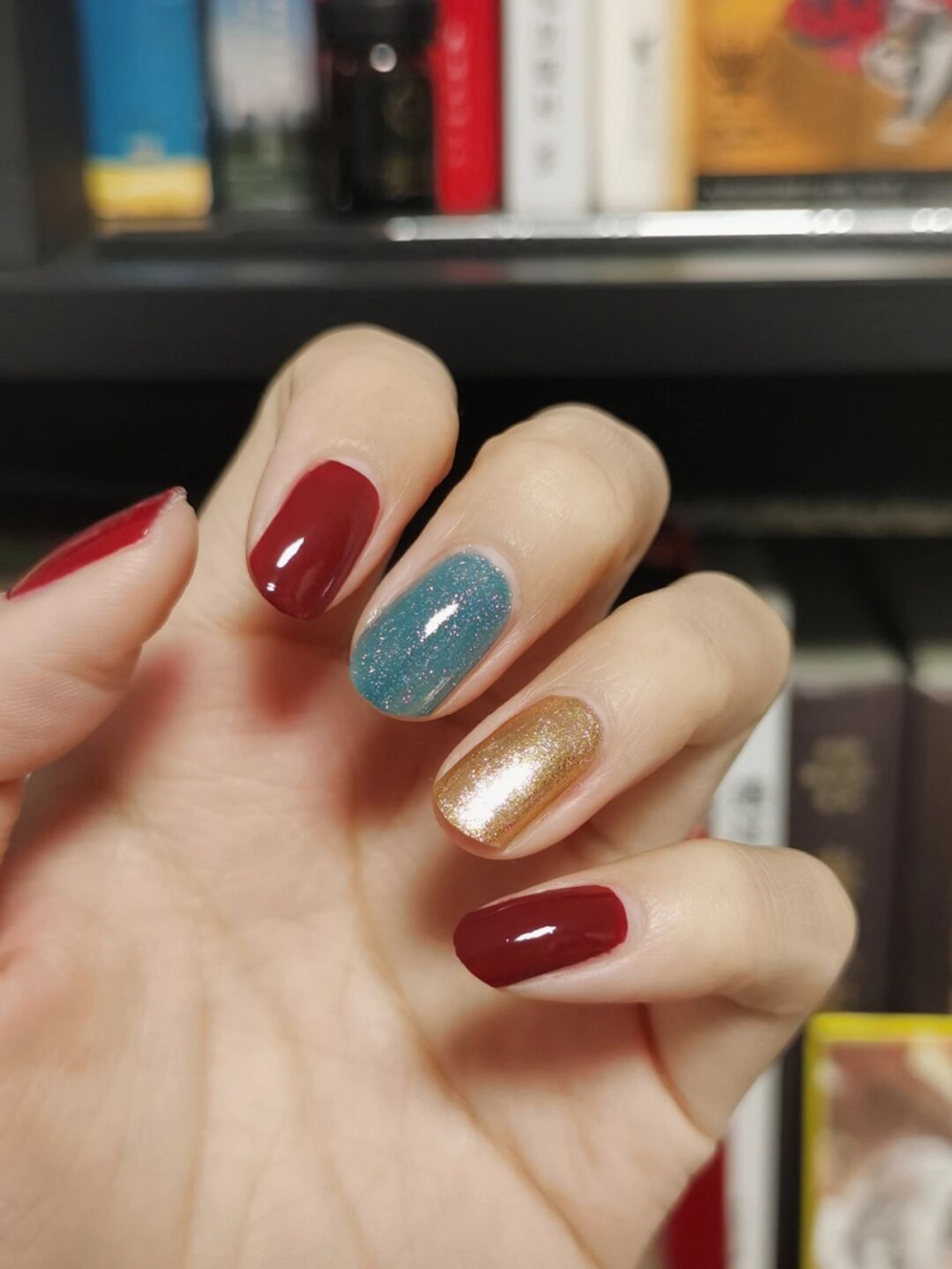 Red, Blue and Gold Simple Short Round Nails shown as a nail art design with red, blue, gold, simple, round and short details.