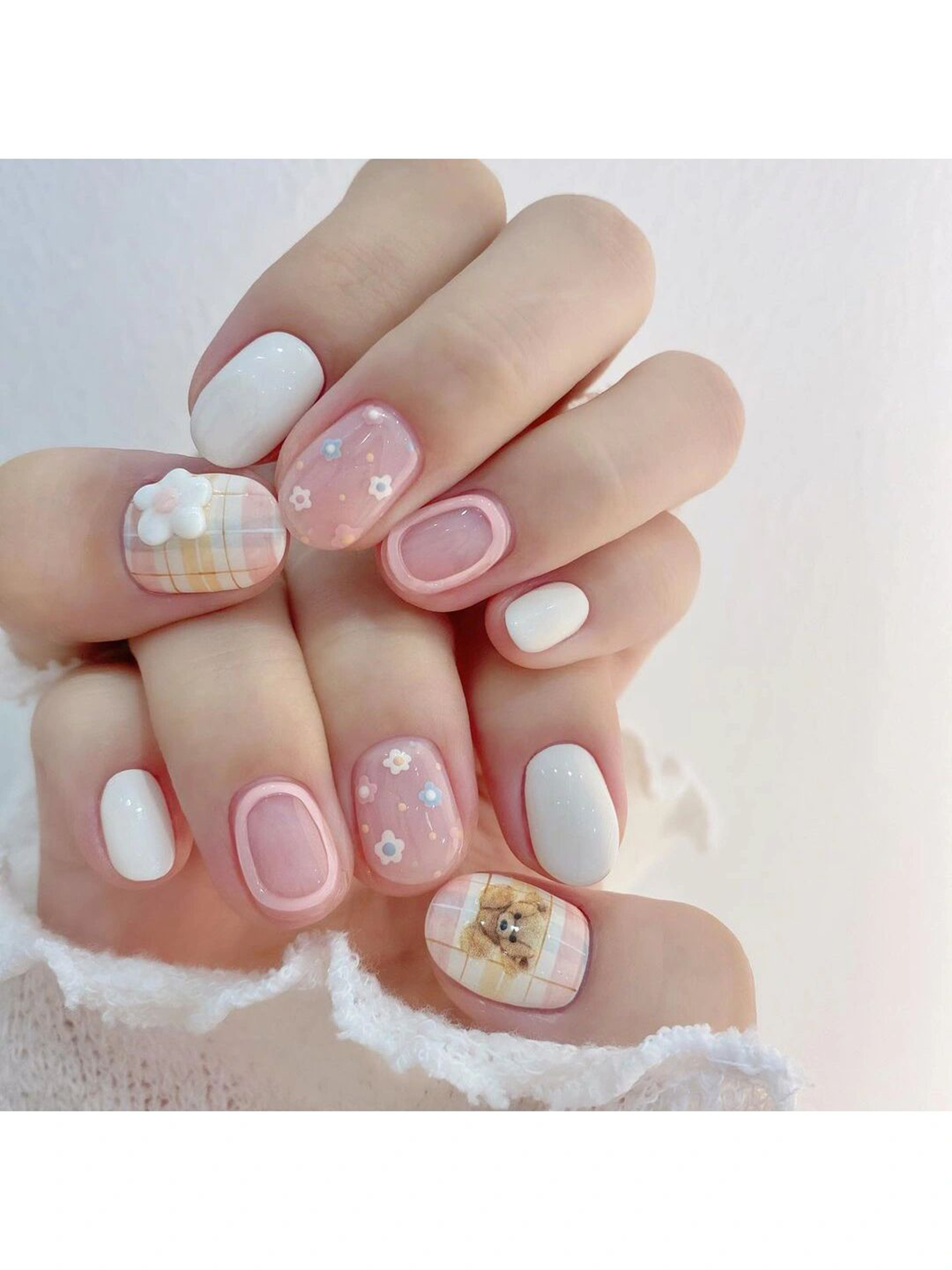 Pink and White Floral Short Round Nails shown as a nail art design with pink, white, cute, floral, flower, round and short details.