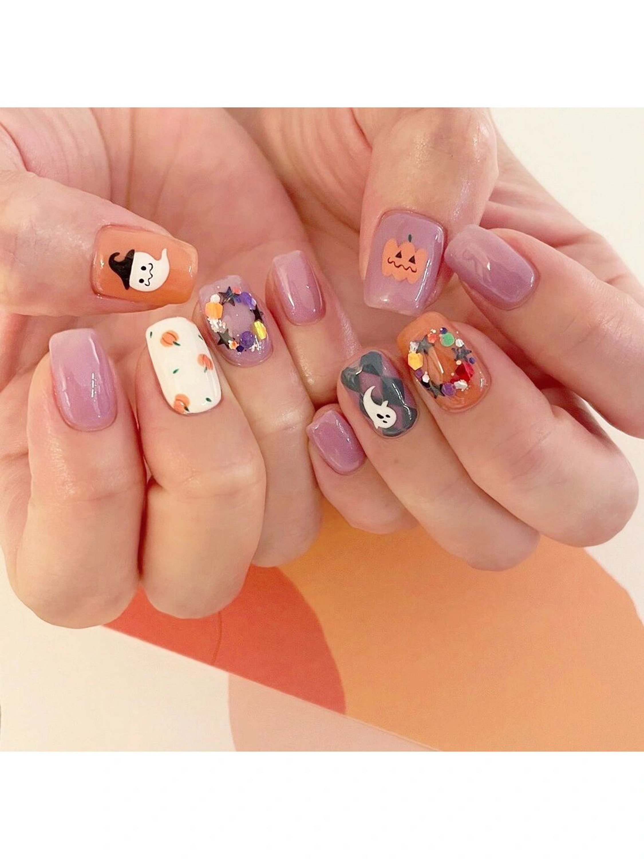 Orange, Purple and White Floral Short Round Nails shown as a nail art design with orange, purple, white, cute, gel, flower, round and short details.
