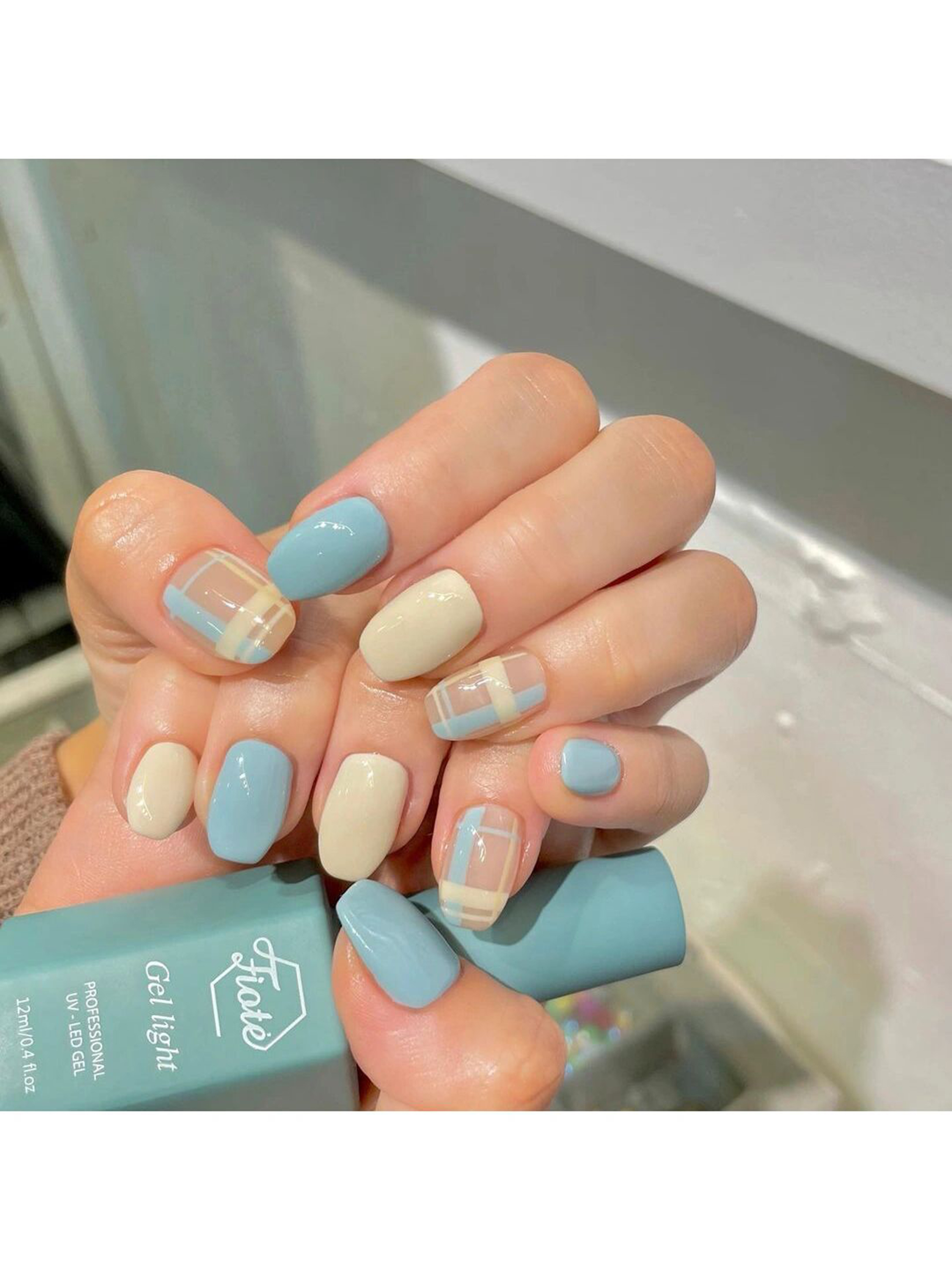 Pastel, Blue and Yellow Simple Short Round Nails shown as a nail art design with pastel, blue, yellow, simple, gel, round and short details.
