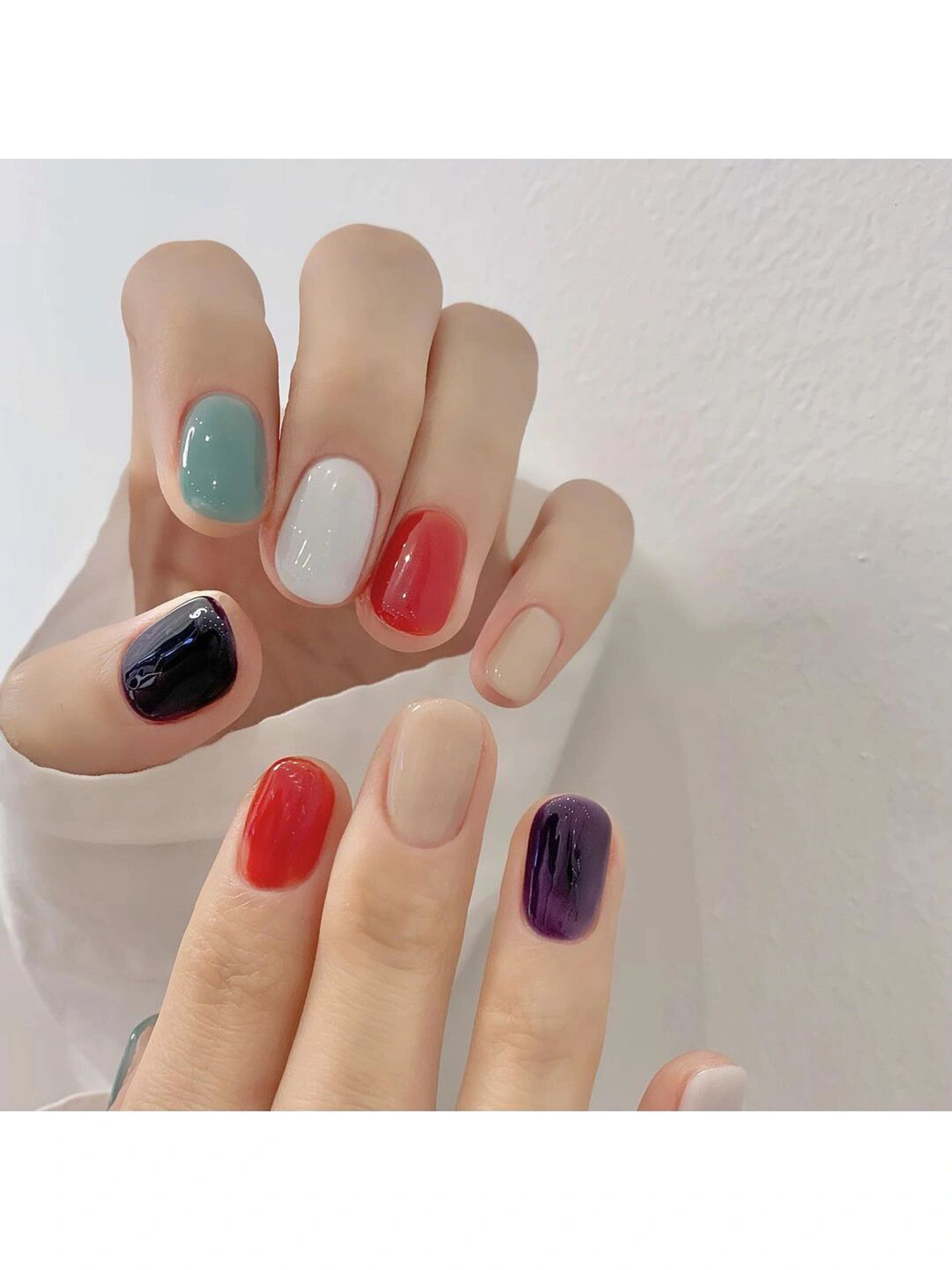 Red, Blue and Green Simple Short Round Nails shown as a nail art design with red, blue, green, simple, round and short details.