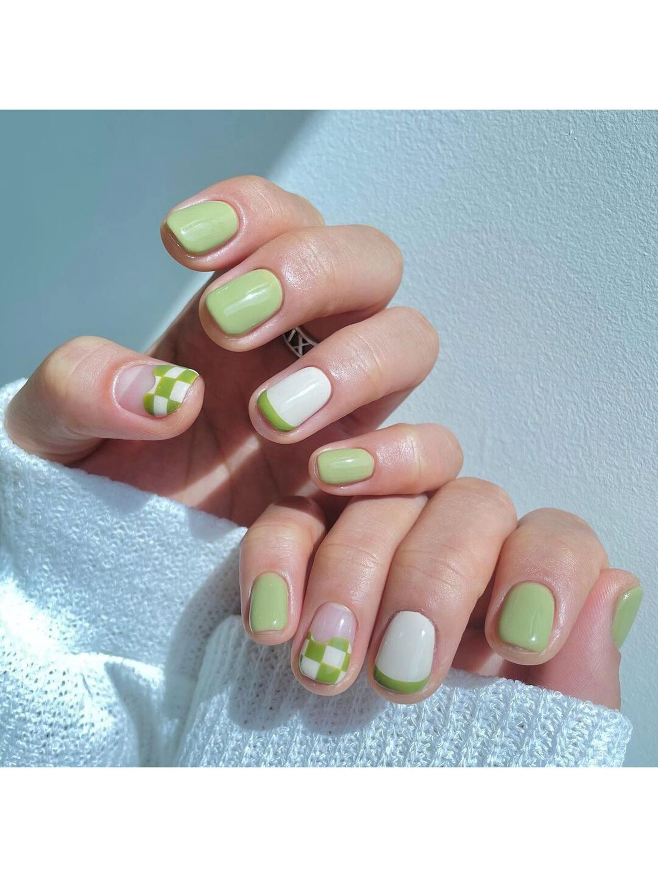 Green and White Floral Short Round Nails shown as a nail art design with green, white, cute, floral, flower, round and short details.