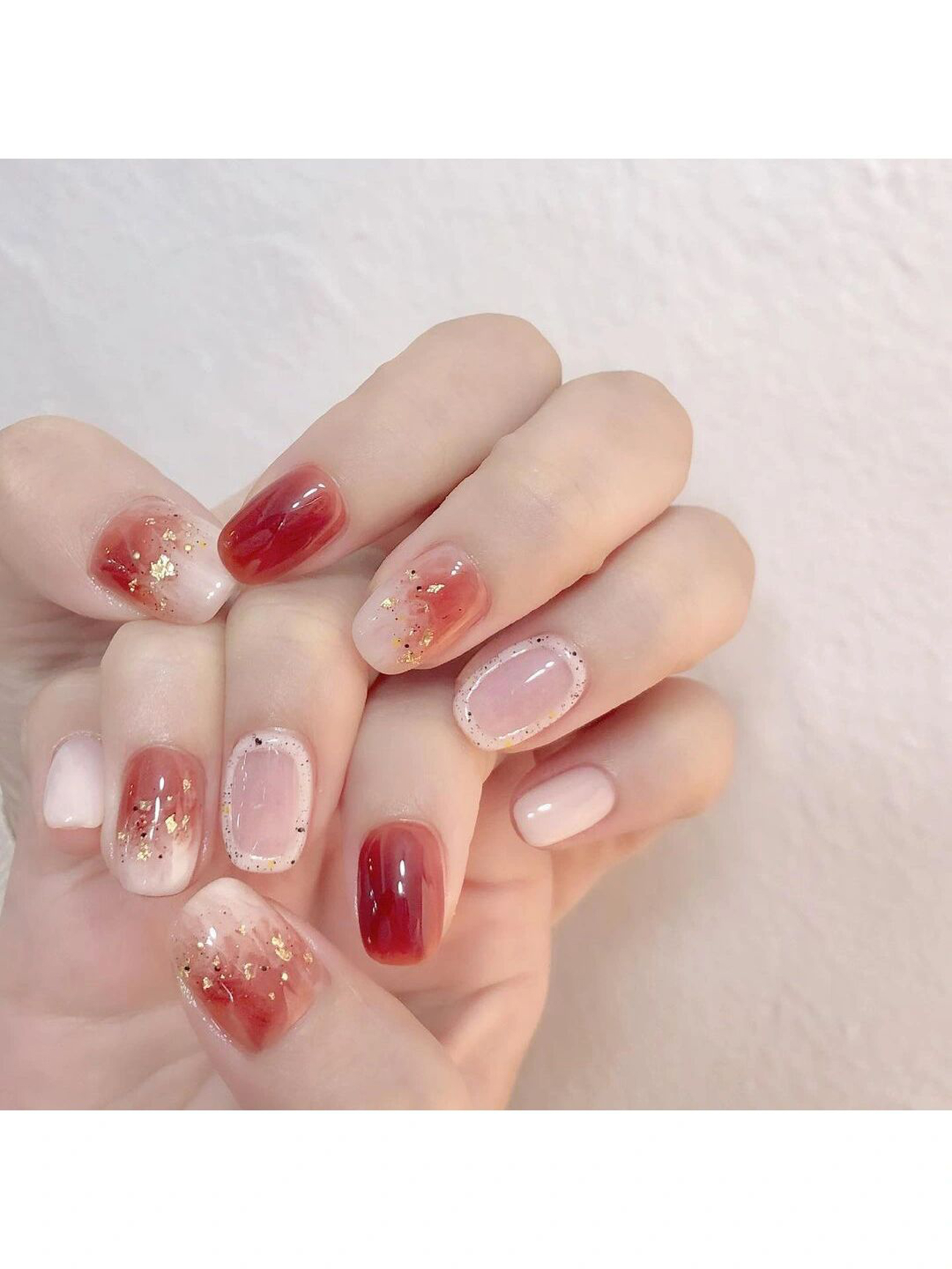 Pink and Red Ombre Short Round Nails shown as a nail art design with pink, red, ombre, glitter, simple, round and short details.