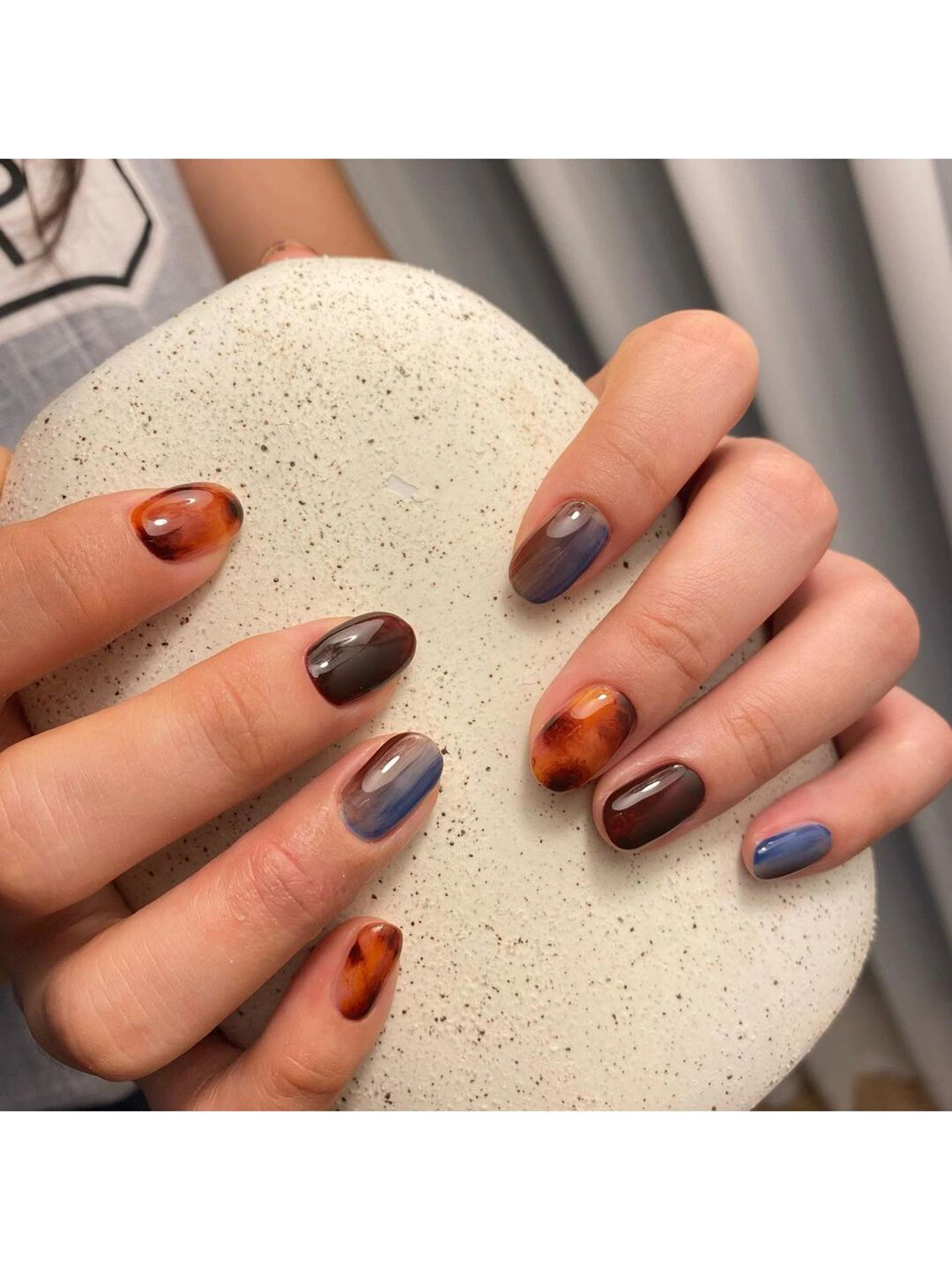 Brown and Black Elegant Short Round Nails shown as a nail art design with brown, black, elegant, classy, round and short details.