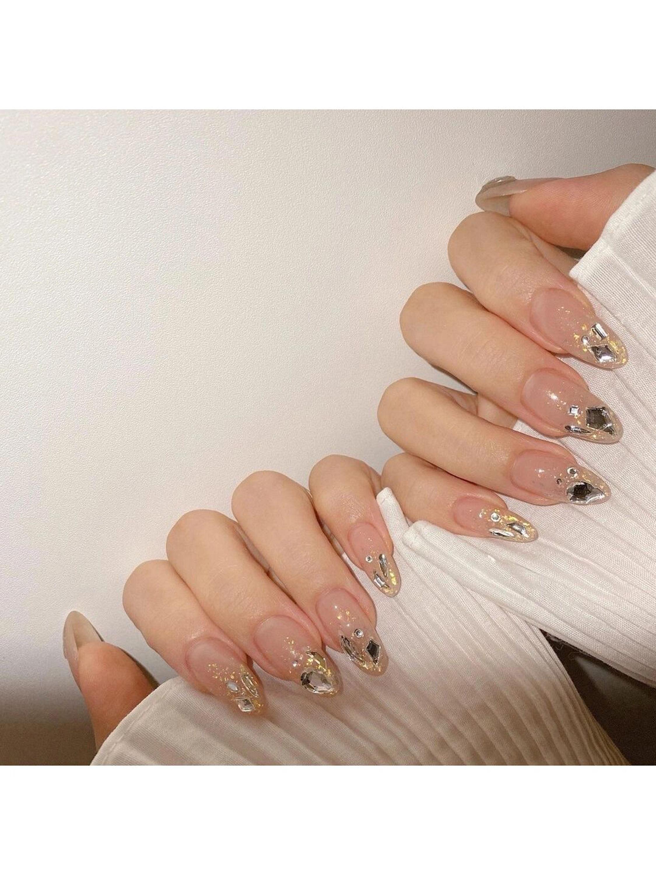 Nude and Gold French Tip Short Round Nails shown as a nail art design with nude, gold, french, glitter, simple, round and short details.