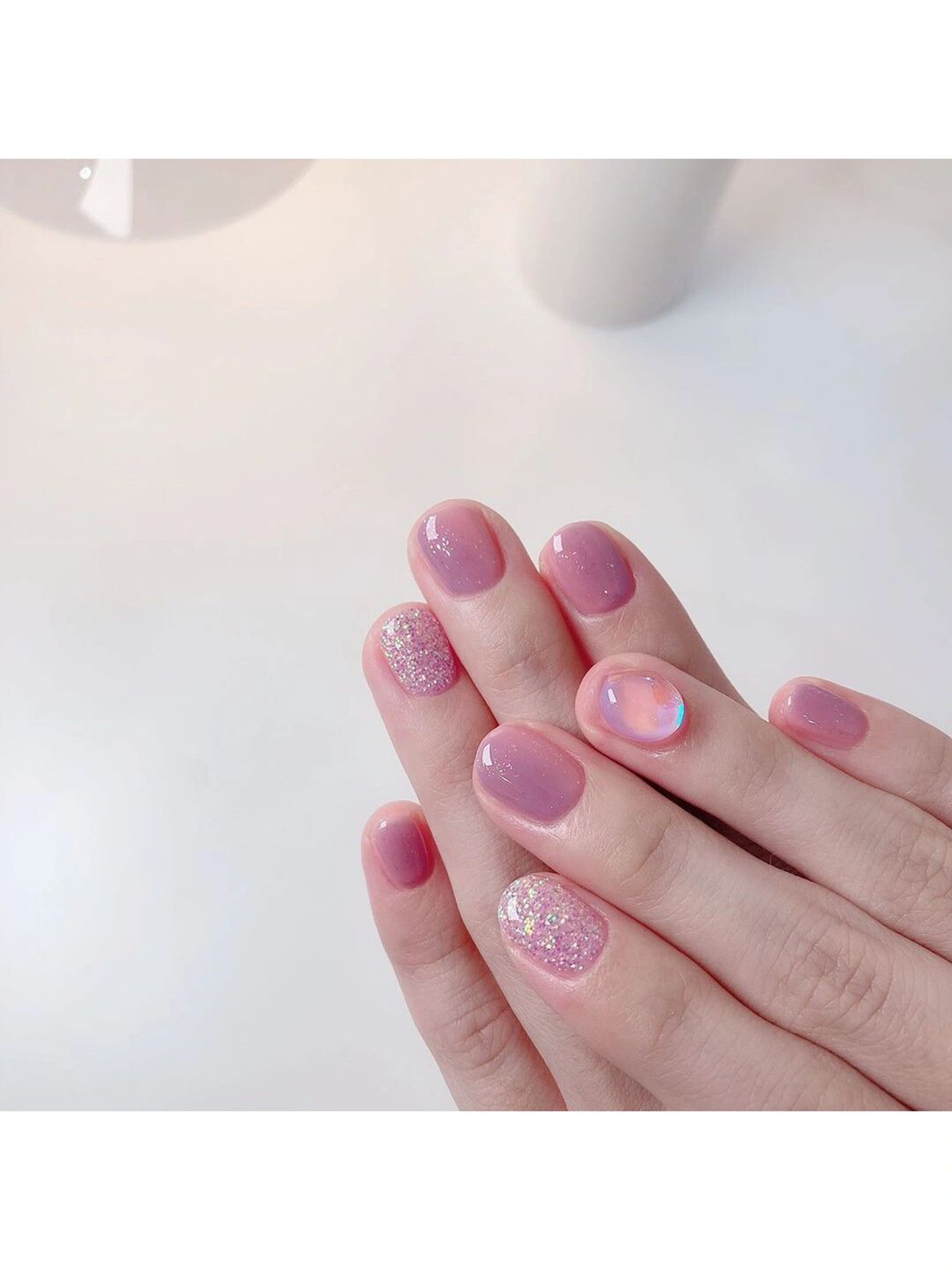 Pink Ombre Short Oval Nails shown as a nail art design with pink, ombre, glitter, oval and short details.