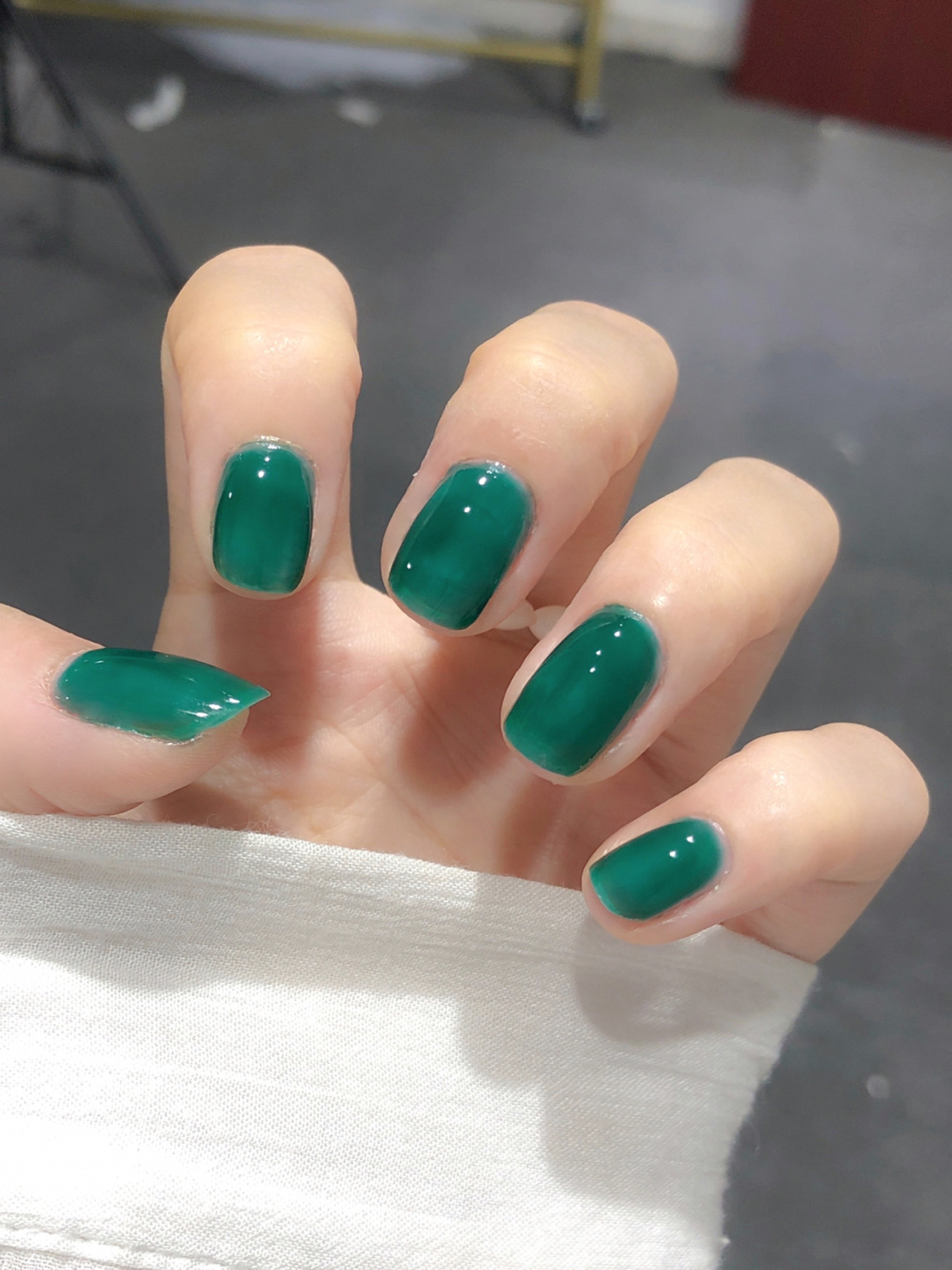 Green Simple Short Square Nails shown as a nail art design with green, simple, gel, square and short details.