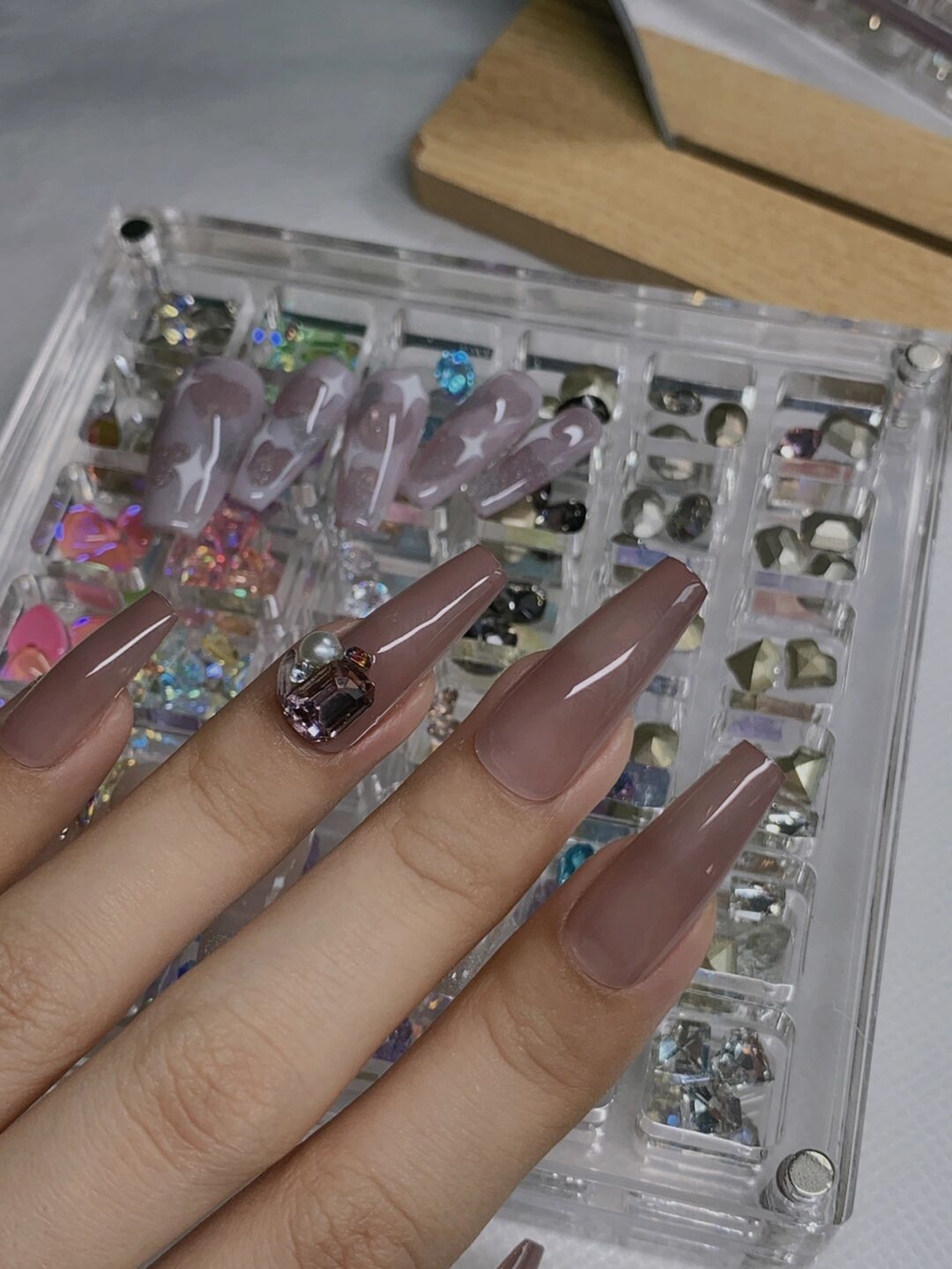 Nude Elegant Long Coffin Nails shown as a nail art design with nude, elegant, coffin and long details.