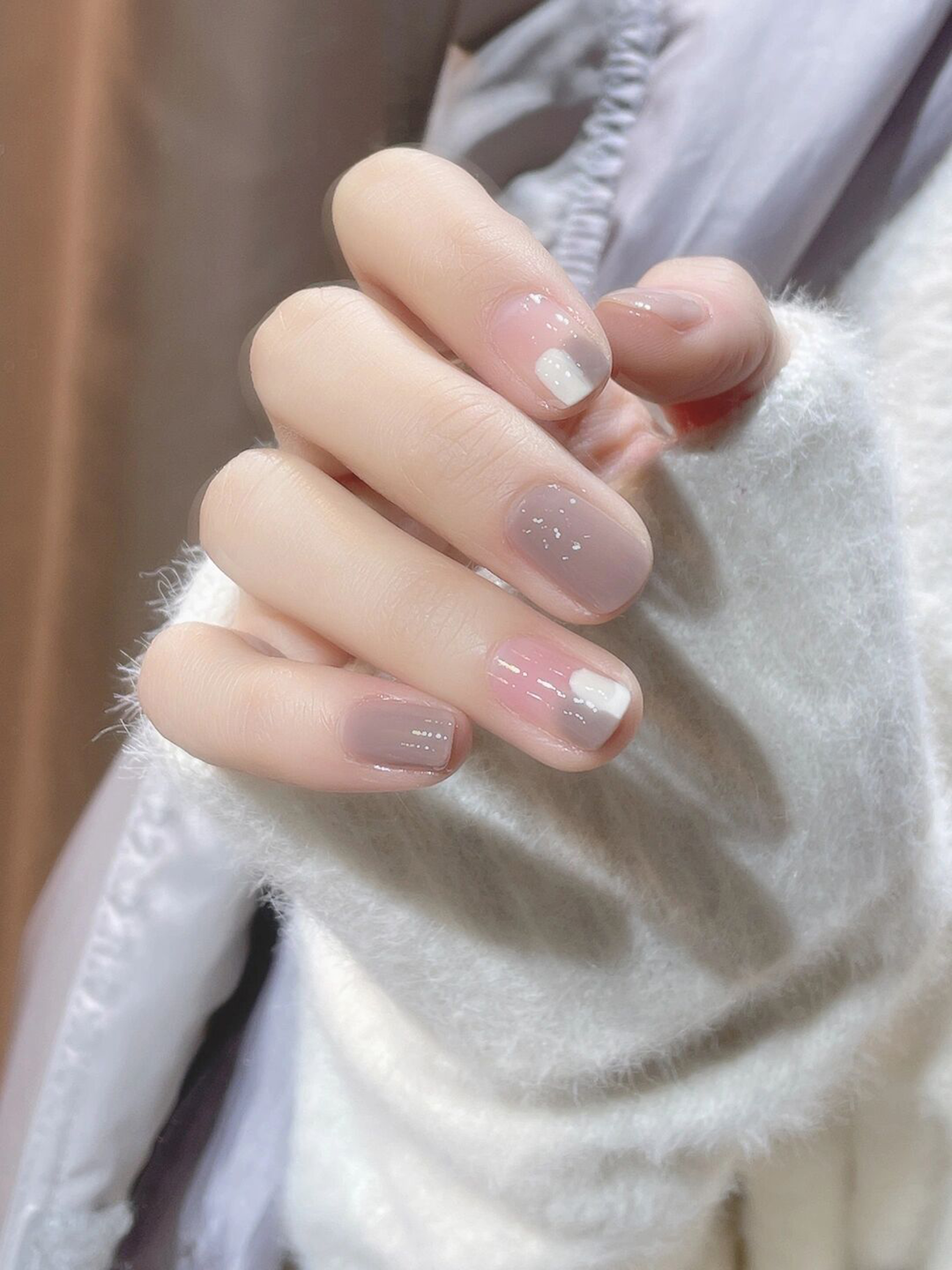 Nude and White Minimal Short Round Nails shown as a nail art design with nude, white, minimal, simple, round and short details.