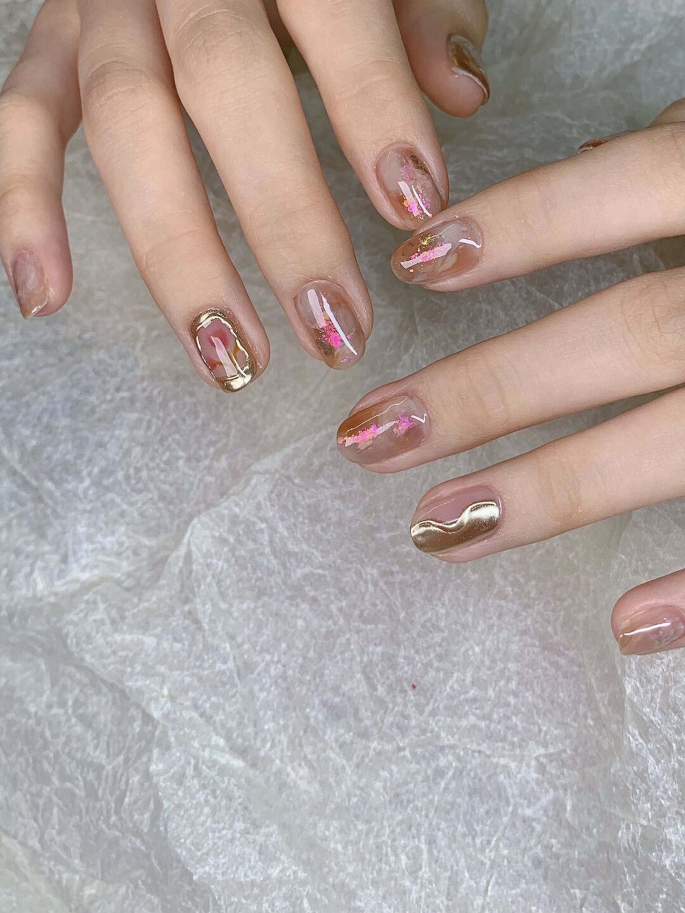 Gold and Pink Abstract Nails shown as a nail art design with gold, pink, abstract, swirl and medium details.