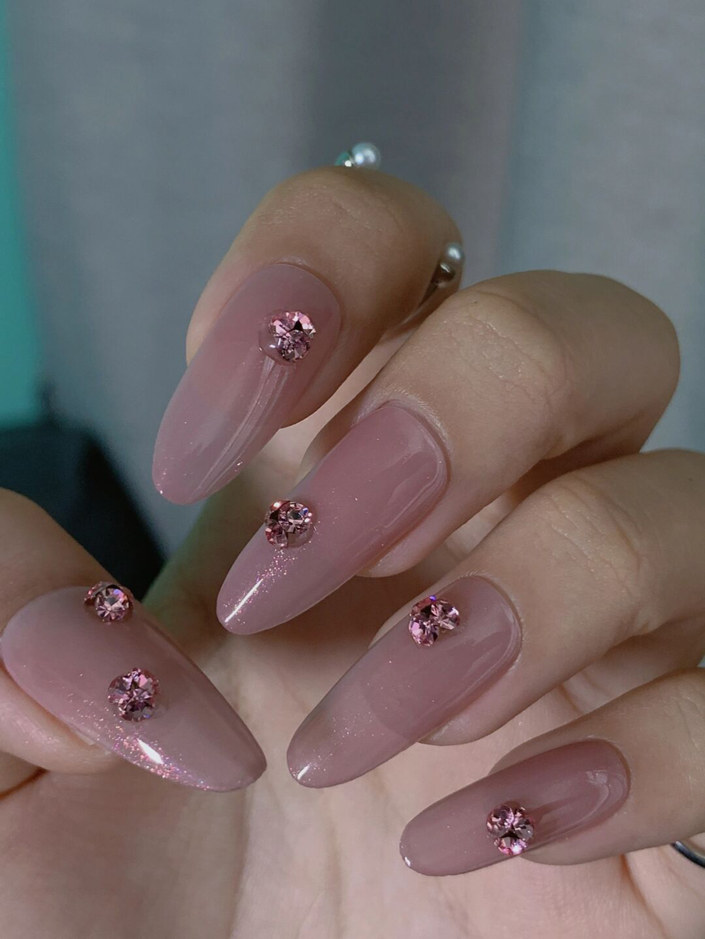 Pink and Nude Elegant Long Almond Nails shown as a nail art design with pink, nude, elegant, almond and long details.