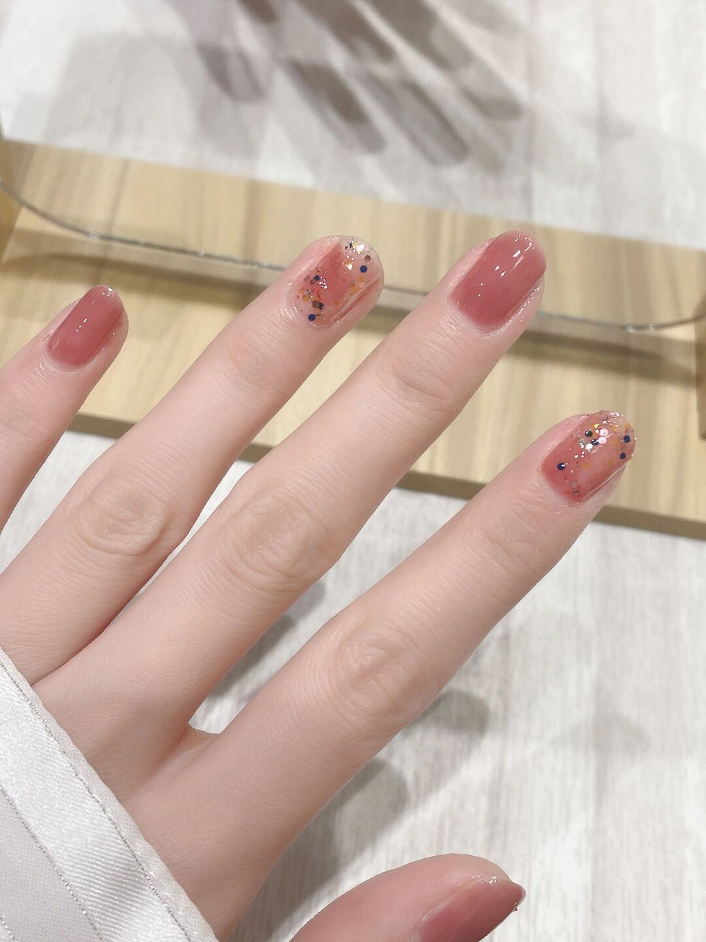 Nude Glitter Round Nails shown as a nail art design with nude, glitter, simple, round and medium details.