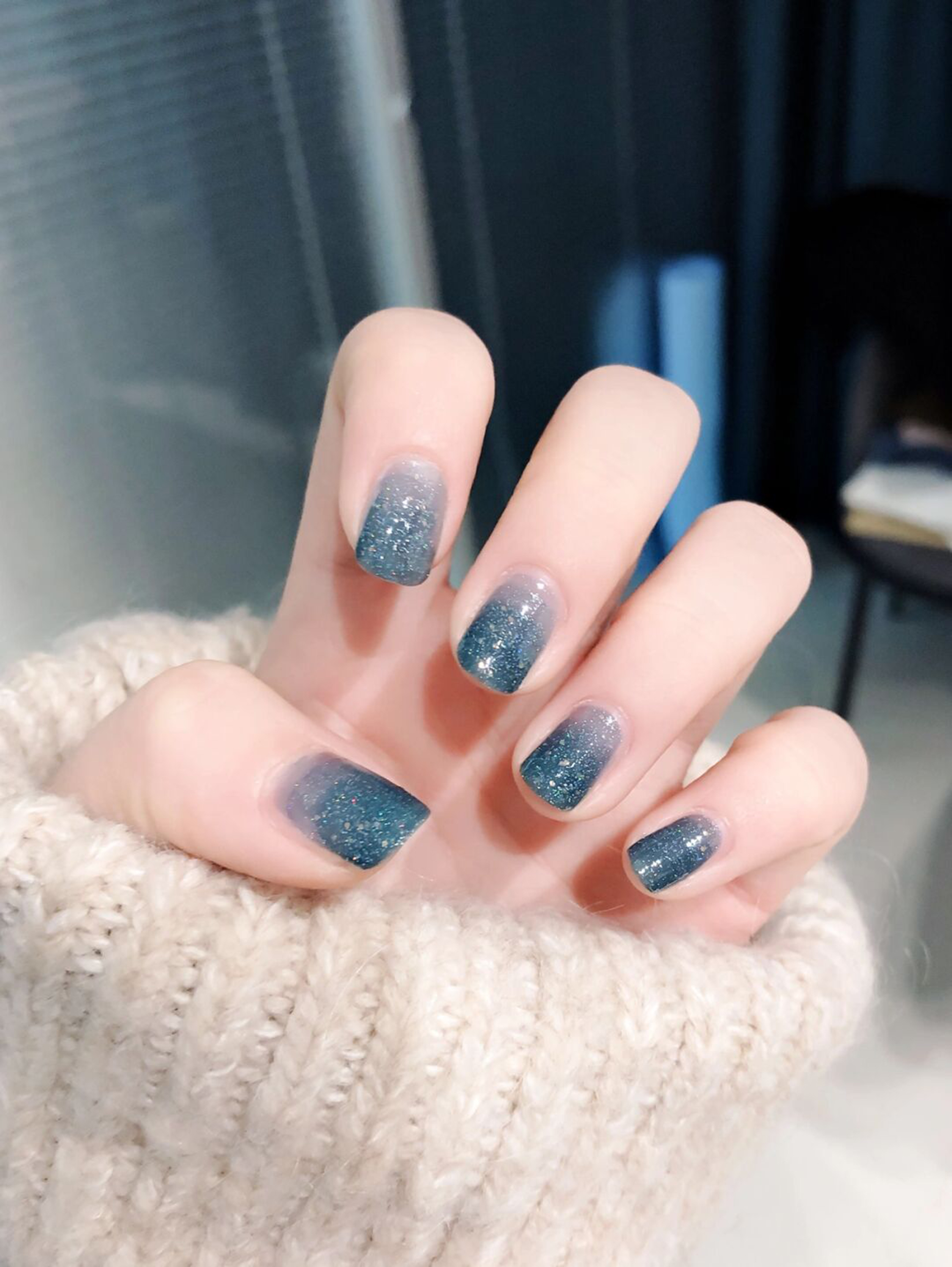 Blue and Silver Ombre Short Square Nails shown as a nail art design with blue, silver, glitter, ombre, square and short details.