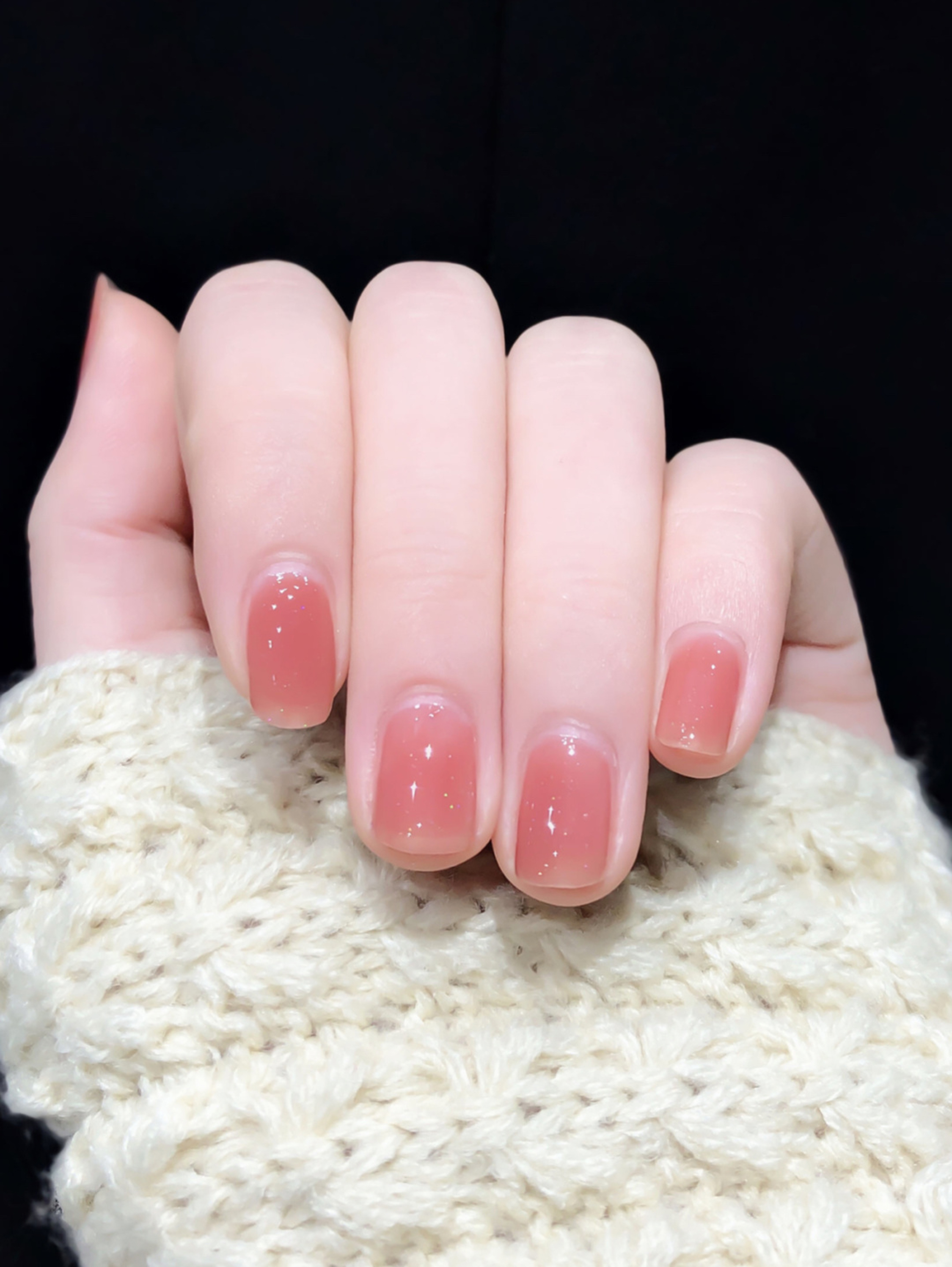 Pink glossy short nails with a clean finish.