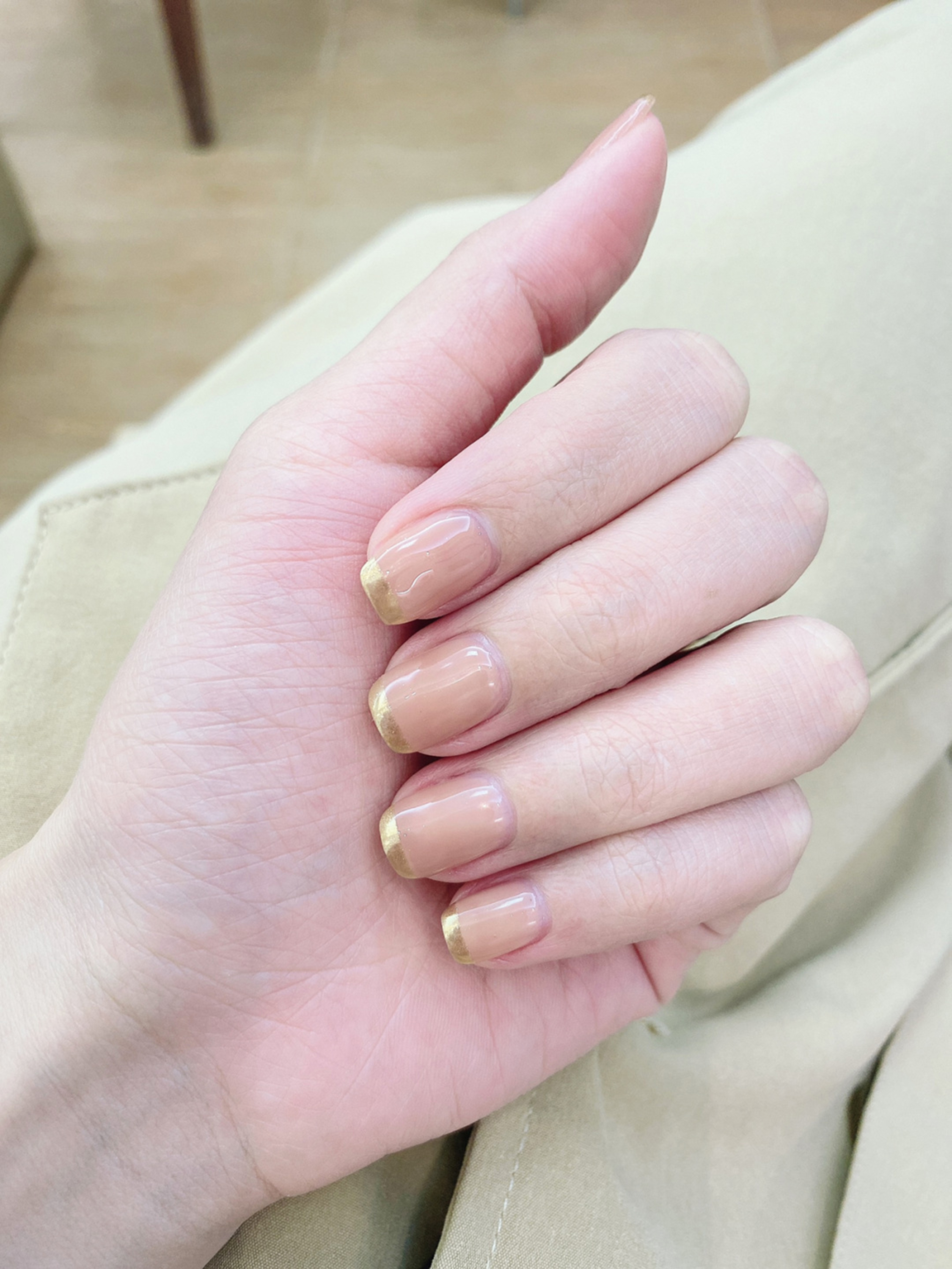 Nude and Gold Simple Short Nails shown as a nail art design with nude, gold, elegant, simple and short details.