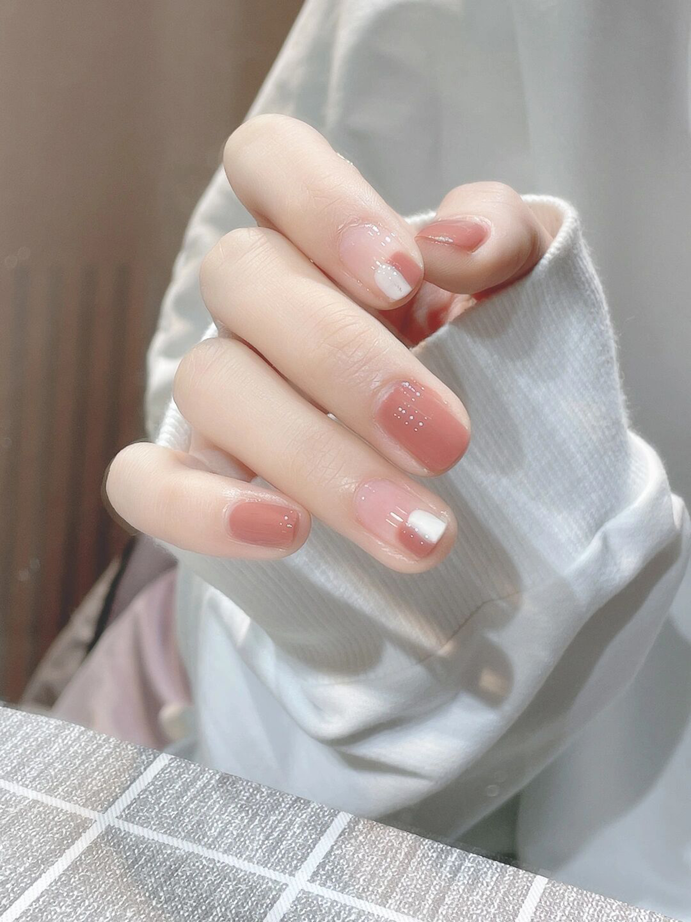 White and Nude Minimal Short Nails shown as a nail art design with white, nude, minimal and short details.