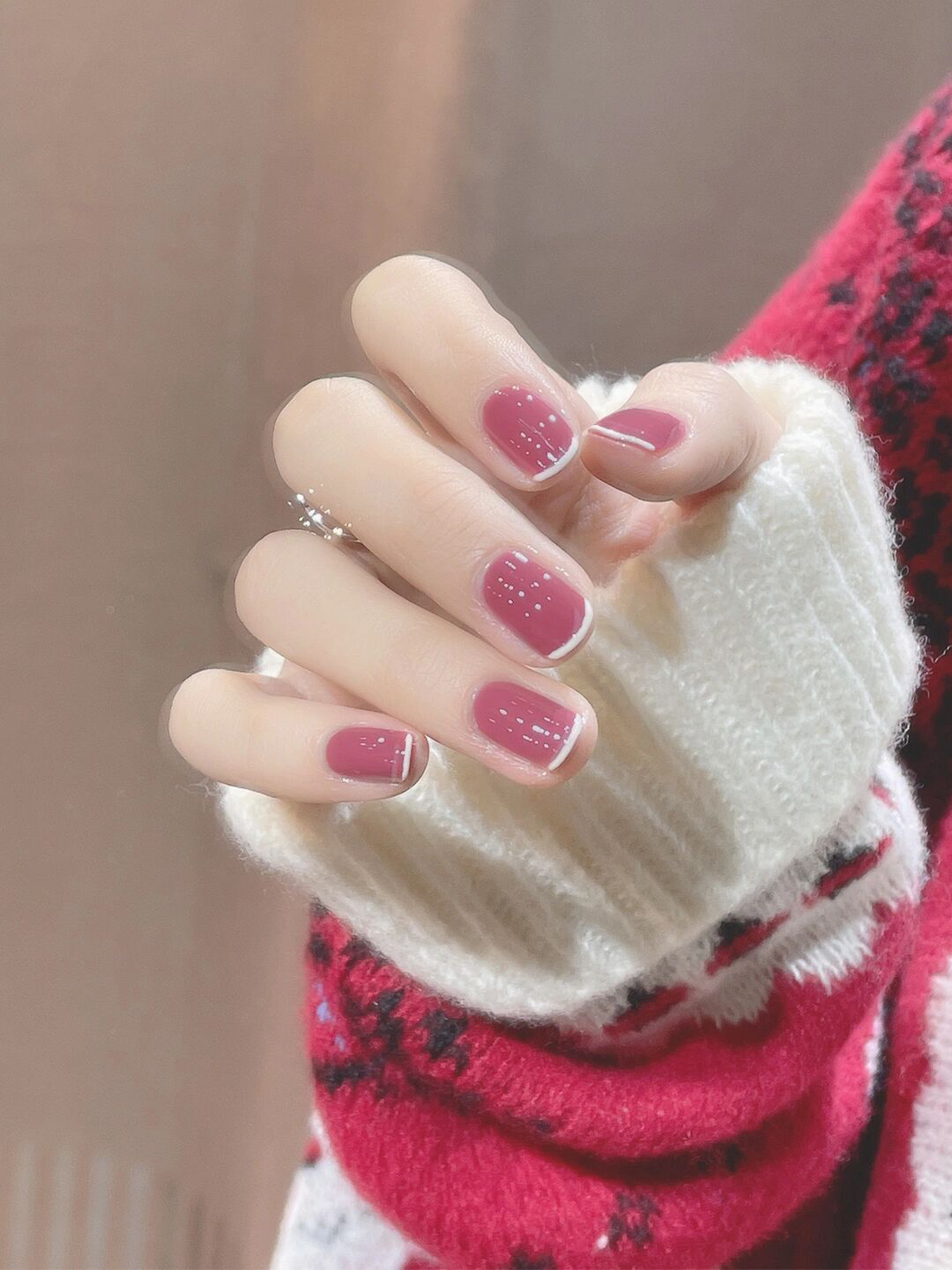 Pink simple short nails with a glossy finish.