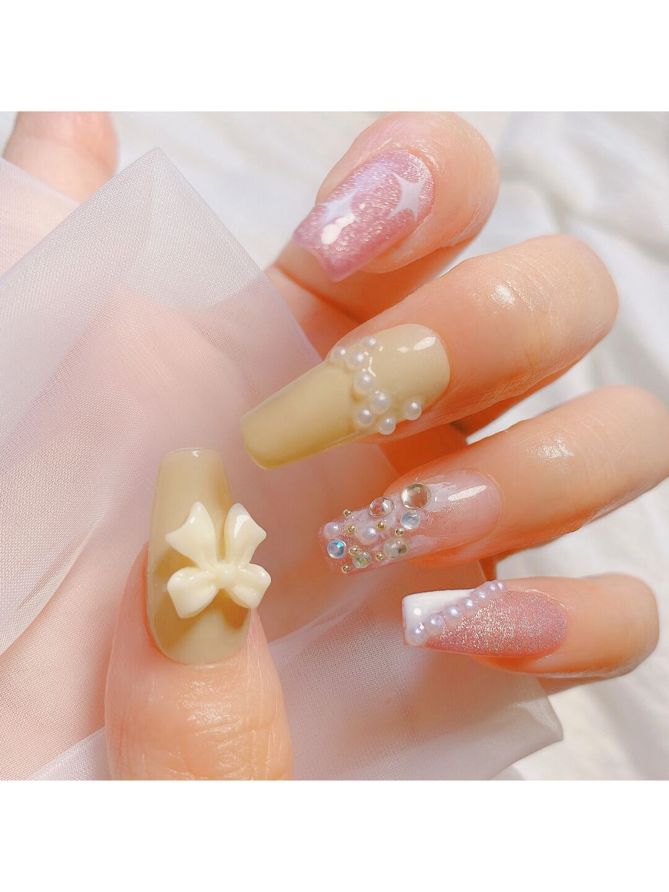 Nude Bow Long Coffin Nails shown as a nail art design with nude, 3d, elegant, bow, coffin and long details.